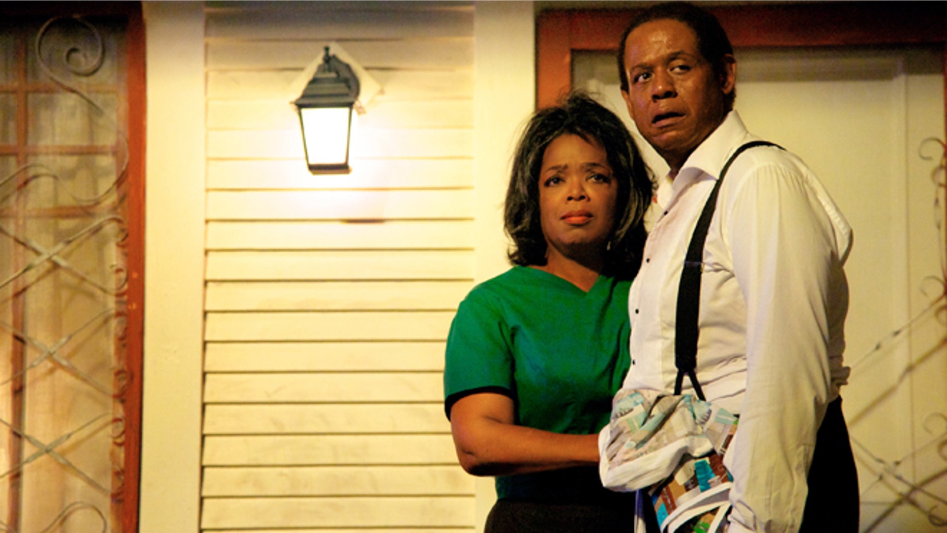 This film image released by The Weinstein Company shows Oprah Winfrey as Gloria Gaines, left, and Forest Whitaker as Cecil Gaines in a scene from Lee Daniels' "The Butler."
