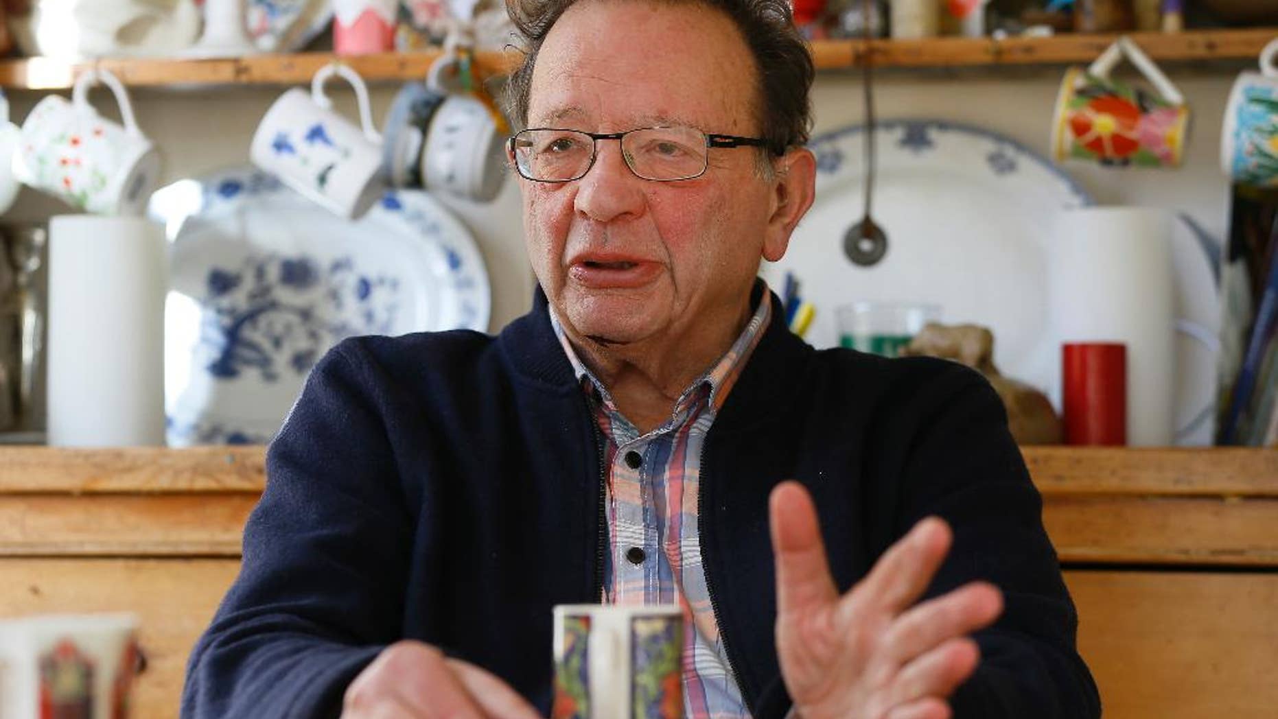 FILE - In this Feb. 15, 2016 file photo, Larry Sanders, the brother of former U.S. presidential candidate Bernie Sanders, sits at home in his kitchen in Oxford, England. Bernie Sanders said on Tuesday, Oct. 11, 2016, that he doesn’t know “a heck of a lot” about British politics but that hasn’t stopped him from endorsing his brother Larry Sanders' bid for a seat in Parliament. (AP Photo/Kirsty Wigglesworth, File)