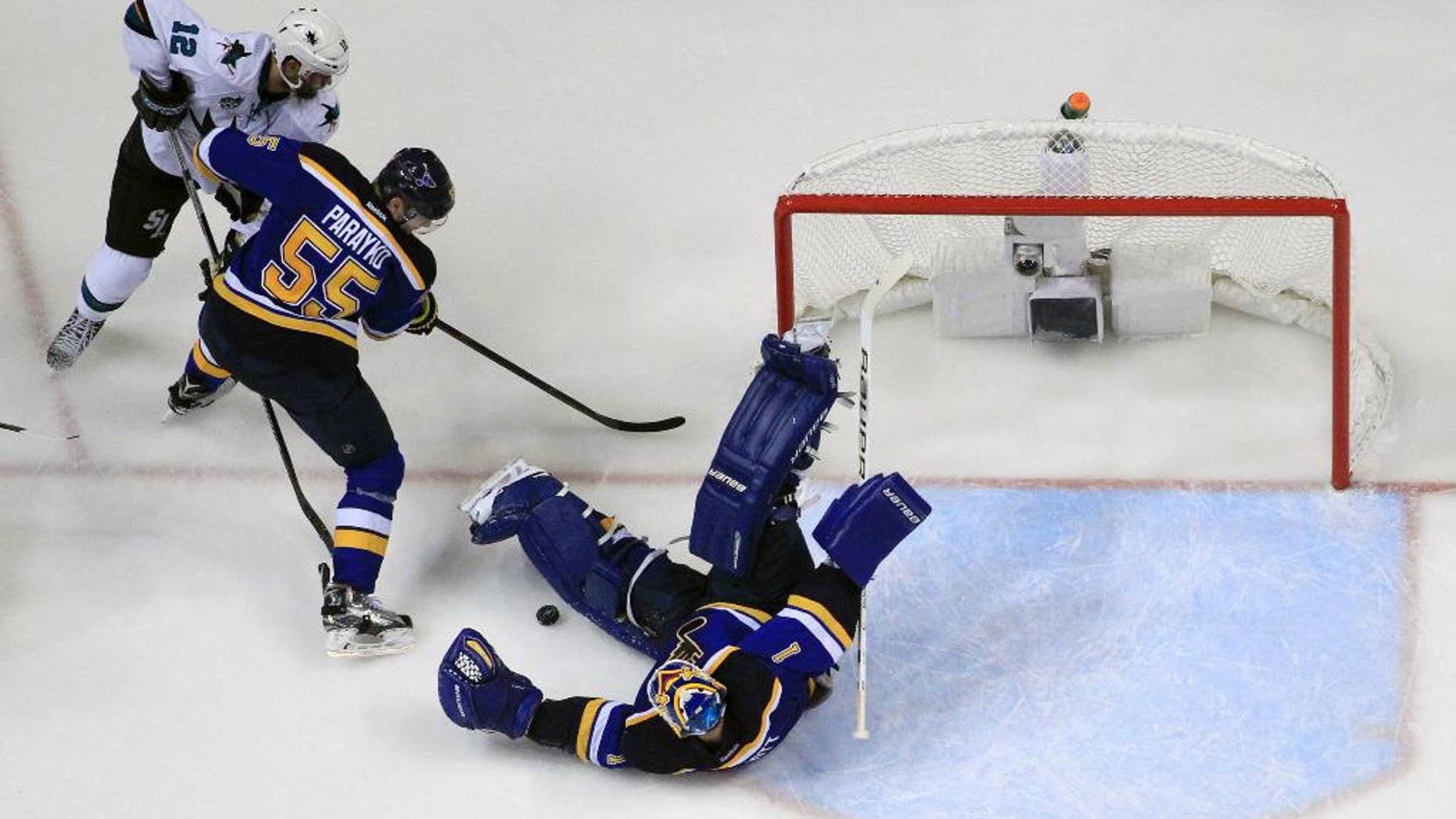 May 15, 2016: St. Louis Blues goalie Brian Elliott (1) makes the save as San Jose Sharks center Patrick Marleau (12) and the Blues defenseman Colton Parayko (55) battle for the puck during the third period in Game 1 of the NHL Western Conference finals in St. Louis