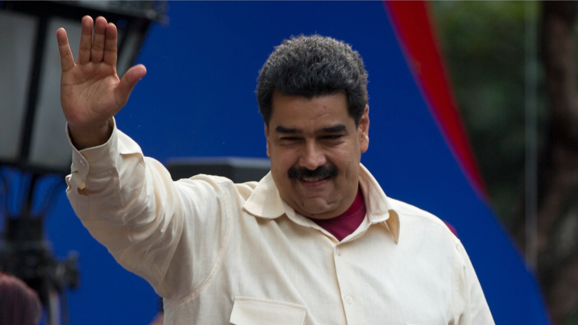 File-This April 19, 2016, file photo shows Venezuelaâs President Nicolas Maduro greeting supporters upon his arrival to Bolivar Square to celebrate the 206th anniversary of the call for independence from Spain, in Caracas, Venezuela. The president is ordering a 30 percent increase in the minimum wage, the latest move by the socialist government to grapple with high inflation and economic stagnation. The boost announced Saturday, April 30, 2016, by Maduro comes after a 25 percent increase on March 1. (AP Photo/Fernando Llano, File)