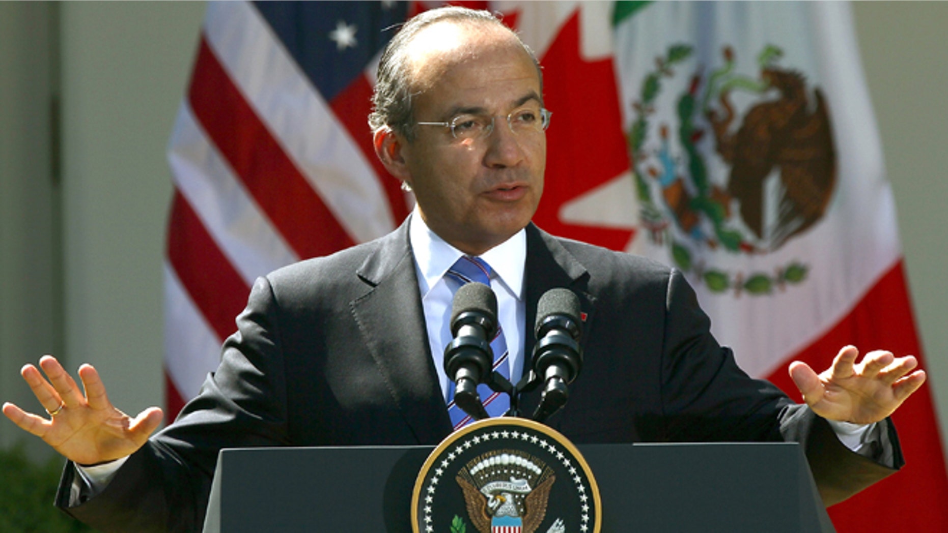 WASHINGTON, DC - APRIL 02: Mexican President Felipe Calderon answers a question during a joint press conference with U.S. President Barack Obama and Canadian Prime Minister Stephen Harper in the Rose Garden of the White House April 2, 2012 in Washington, DC. Obama hosted his counterparts from Canada and Mexico for the North American Leaders' Summit (NALS) with talks on cooperation among the three countries. (Photo by Win McNamee/Getty Images)