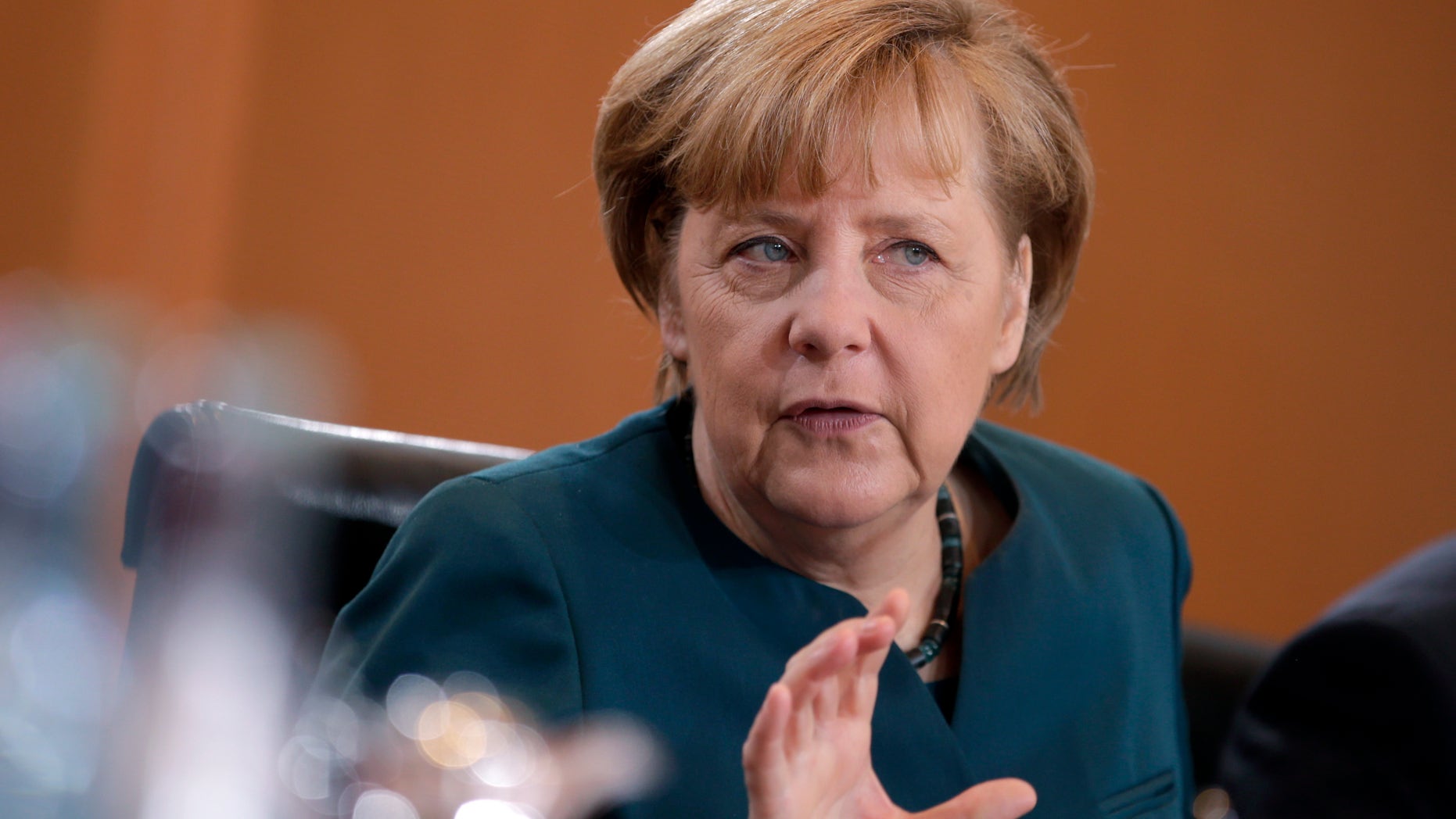 German Chancellor Angela Merkel gestures at the beginning of the weekly cabinet meeting at the chancellery in Berlin, Germany, Wednesday, Jan. 15, 2014. (AP Photo/Michael Sohn)