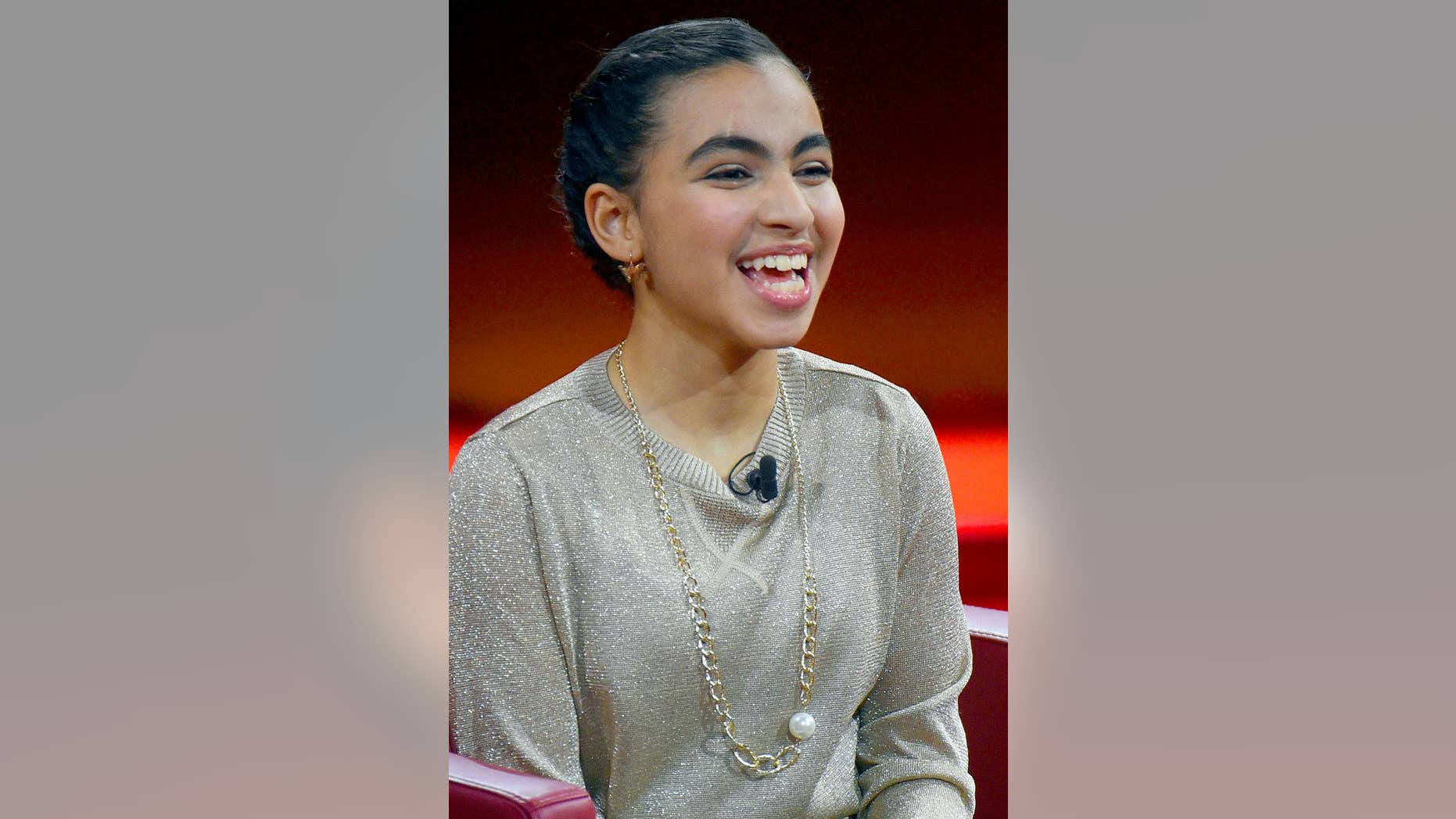 FILE - In this Dec. 6, 2015 file picture Palestinian student Reem Sahwil sits on stage during RTL's end-of-year review '2015! Menschen, Bilder, Emotionen' (lit. People, images, emotions) in Huerth, Germany. The Palestinian girl whose encounter with German Chancellor Angela Merkel made waves last year says the incident was a turning point in her life. Reem Sawhil burst into tears during a town hall event with Merkel last July as she recounted how she feared that she or her family might be deported. Sawhil told German weekly Bild am Sonntag that she had gained confidence following the incident and recently attempted to walk unaided. (Henning Kaiser/dpa via AP,file)