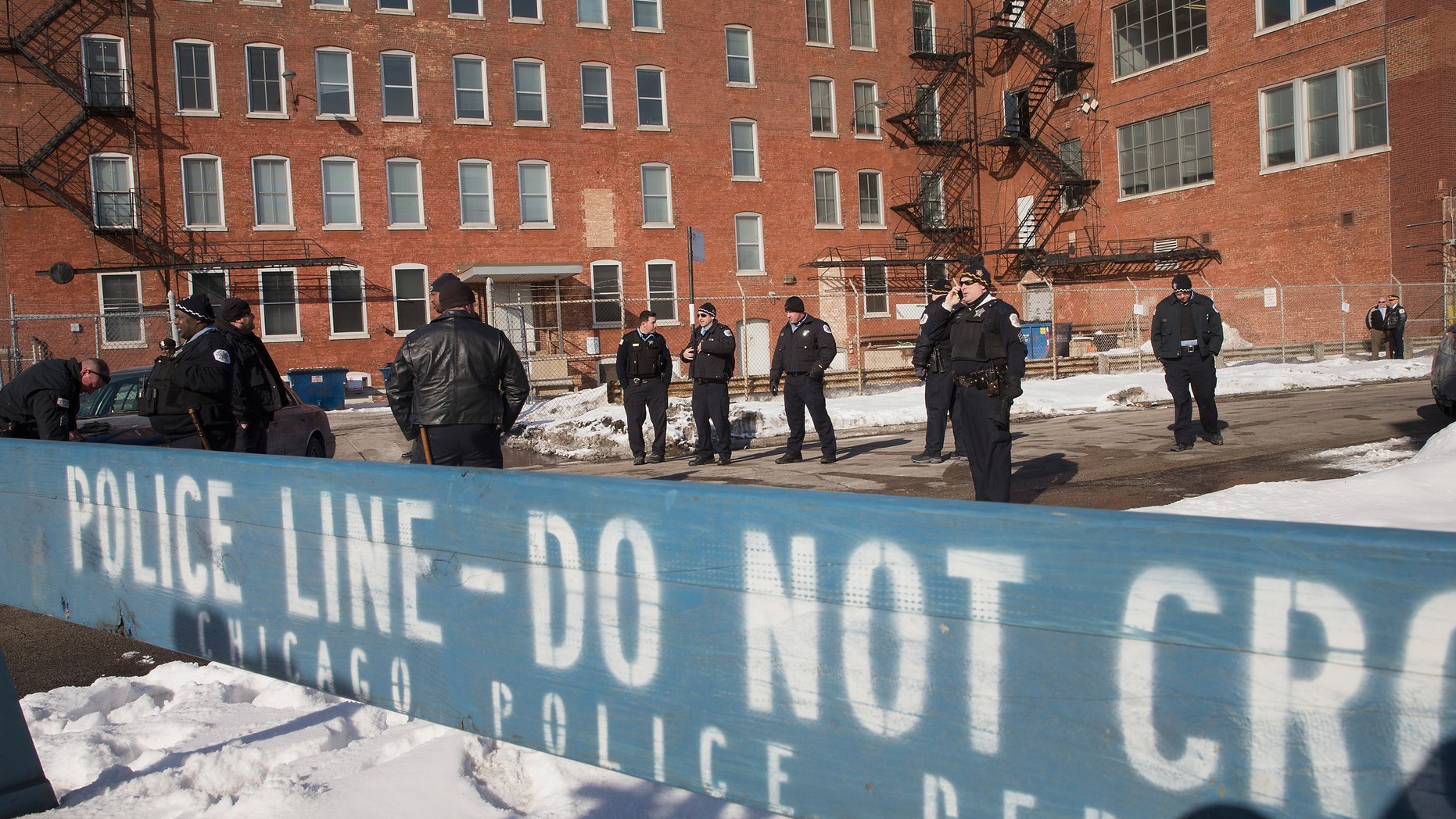 CHICAGO, IL - FEBRUARY 28: Police stand guard as demonstrators protest outside a Chicago Police facility on the city's Westside on February 28, 2015 in Chicago, Illinois. The demonstrators were demanding changes after a British newspaper article recently claimed the facility was used by Chicago police as a 'secret interrogation facility.' (Photo by Scott Olson/Getty Images)
