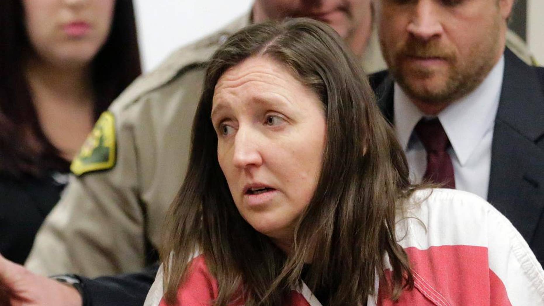 Feb. 12, 2015: In this file photo, Megan Huntsman arrives in court in Provo, Utah. Huntsman who pleaded guilty to killing six of her newborn babies and storing their bodies in her garage is set to be sentenced.