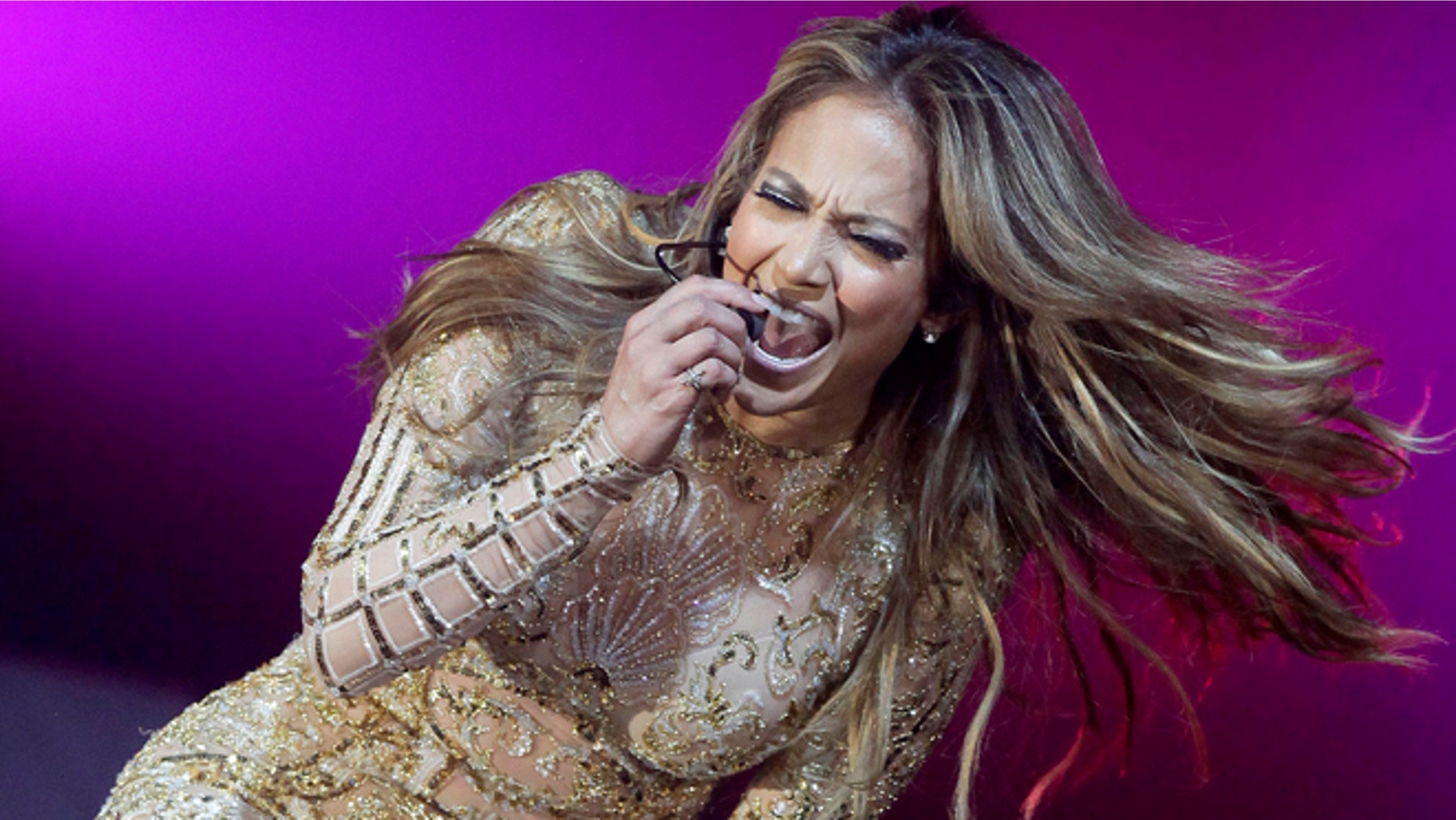 In this March 23, 2013 file photo, actress and entertainer Jennifer Lopez performs at Muhammad Ali's Celebrity Fight Night XIX at the JW Marriott Desert Ridge Resort and Spa, in Phoenix.