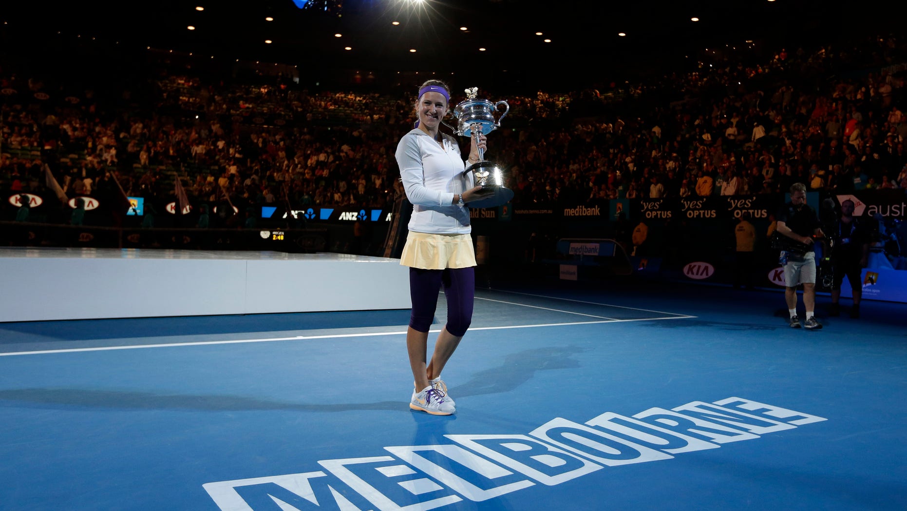 Victoria Azarenka of Belarus holds her trophy after winning the women's final against China's Li Na at the Australian Open tennis championship in Melbourne, Australia, Saturday, Jan. 26, 2013. (AP Photo/Andy Wong)
