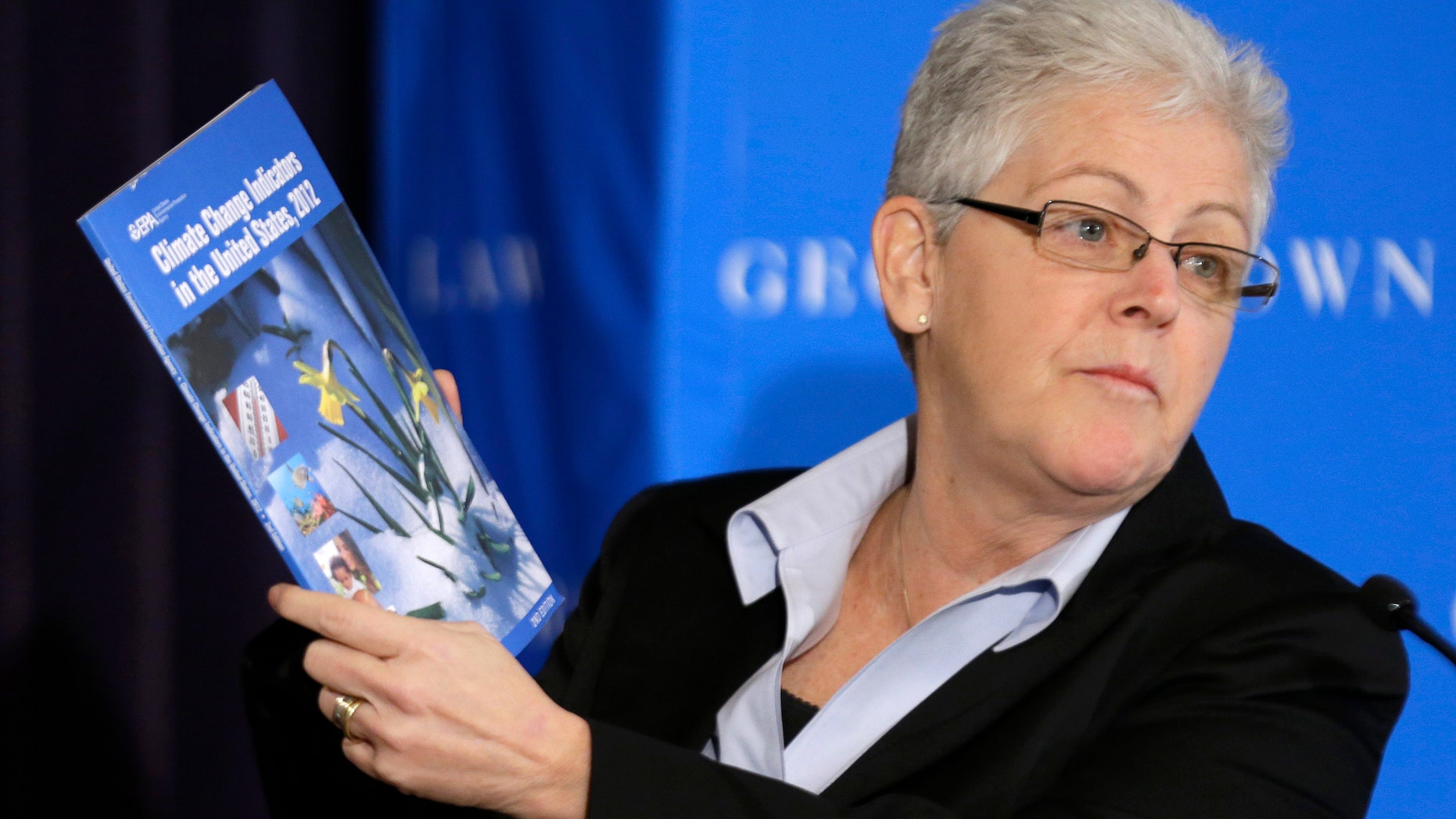 Feb. 21, 2013: Gina McCarthy, then-Assistant Administrator with the Environmental Protection Agency and current Administrator, holds a climate change report as she speaks at a climate workshop sponsored by The Climate Center at Georgetown University.