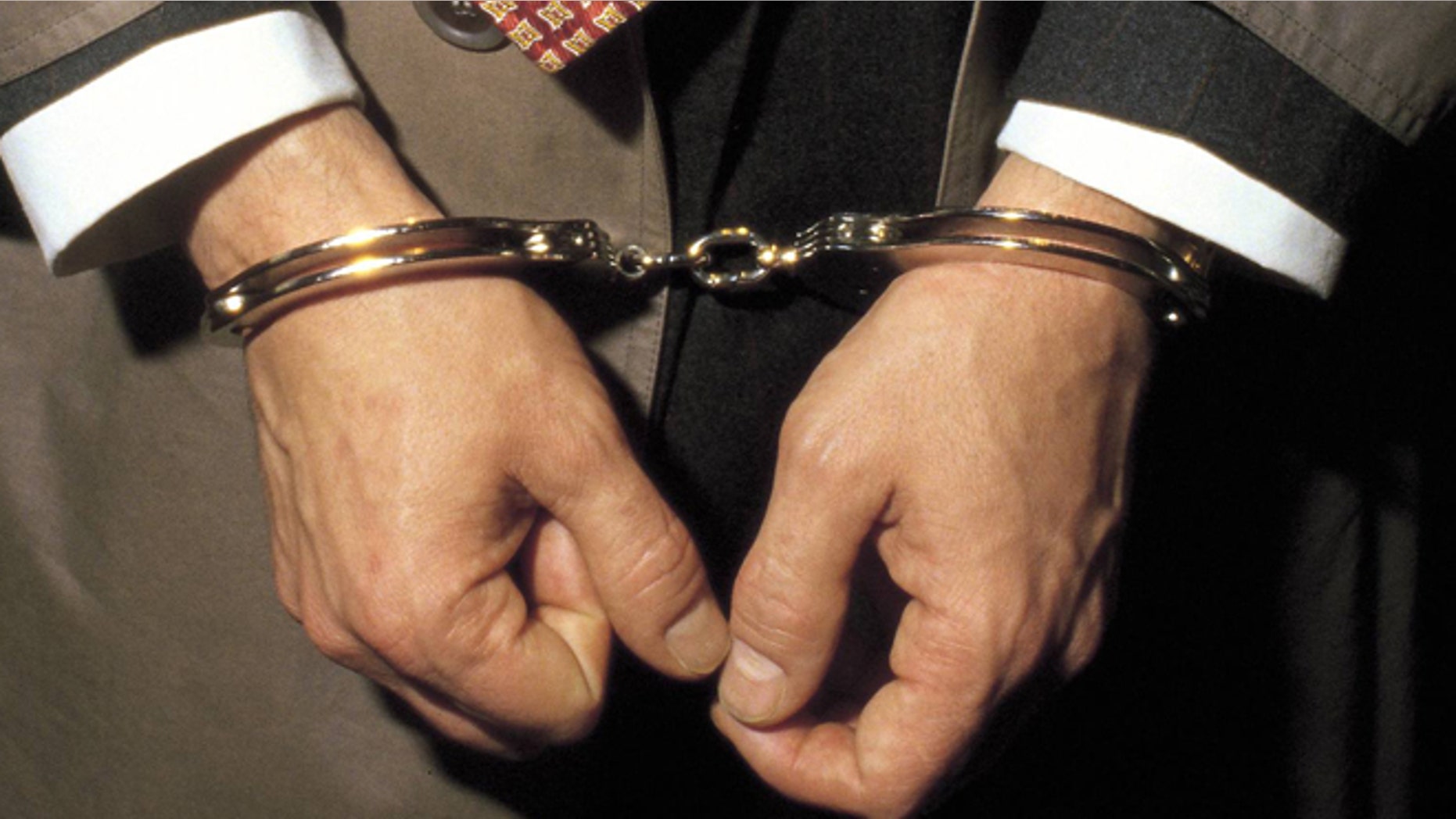 Person under arrest with handcuffs Detail of the handcuffed hands of a man under arrest (Photo by Matias Nieto/Cover/Getty Images)
