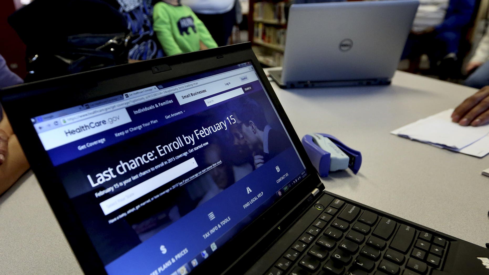 In this Thursday, Feb. 12, 2015 photo, a laptop shows the HealthCare.com web site during an Affordable Care Act enrollment event at the Fort Worth Public Library in Fort Worth, Texas. For the second year in a row, millions of Americans have signed up for subsidized health insurance under President Barack Obama's law. But as the 2015 sign-up season draws to a close Sunday, the future of the Affordable Care Act remains in doubt. (AP Photo/LM Otero)