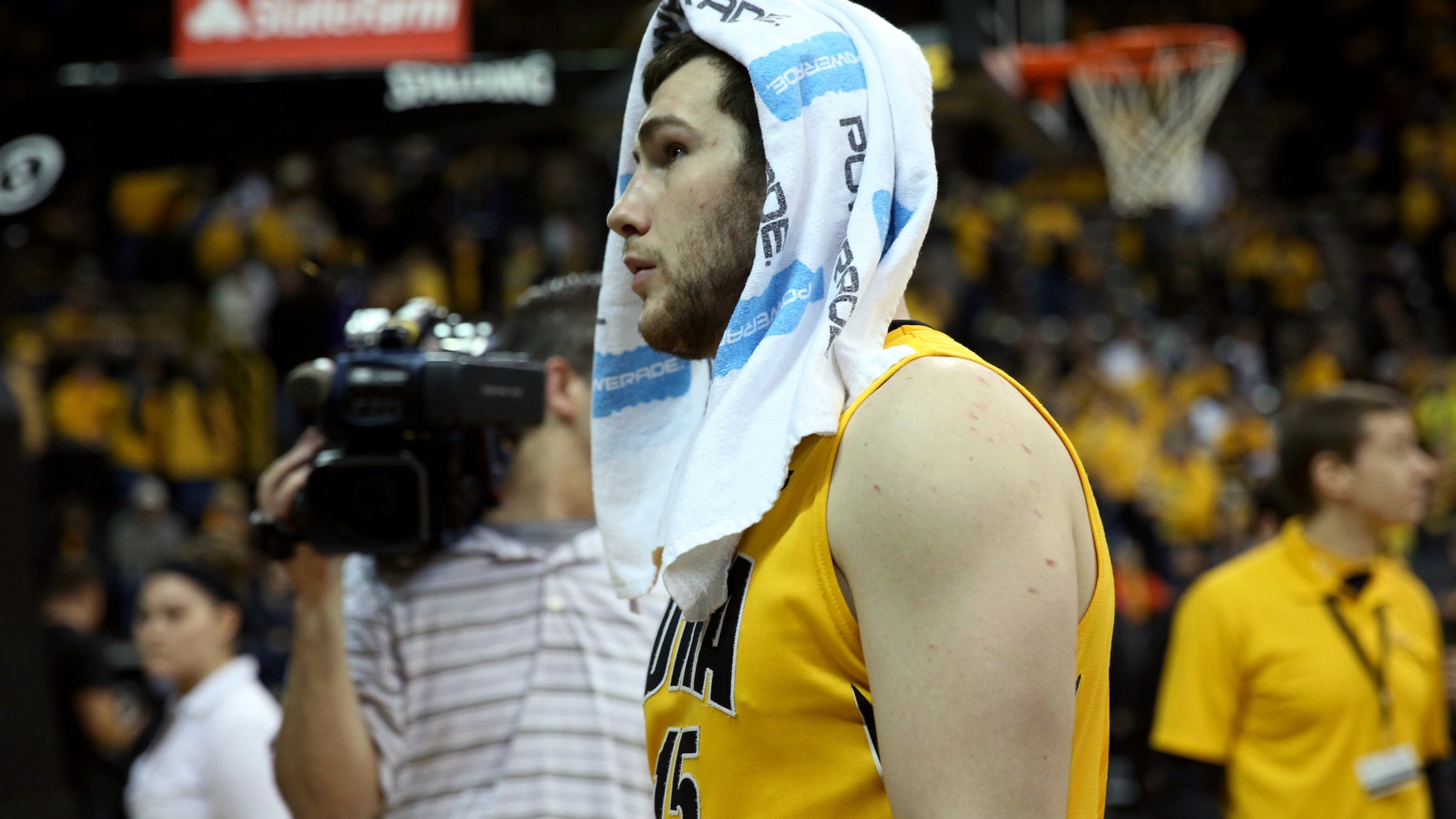 Iowa forward Zach McCabe walks off the floor after their 79-74 loss to Wisconsin during an NCAA college basketball game in Iowa City, Iowa, Saturday, Feb. 22, 2014. Wisconsin won 79-74. (AP Photo/Justin Hayworth)