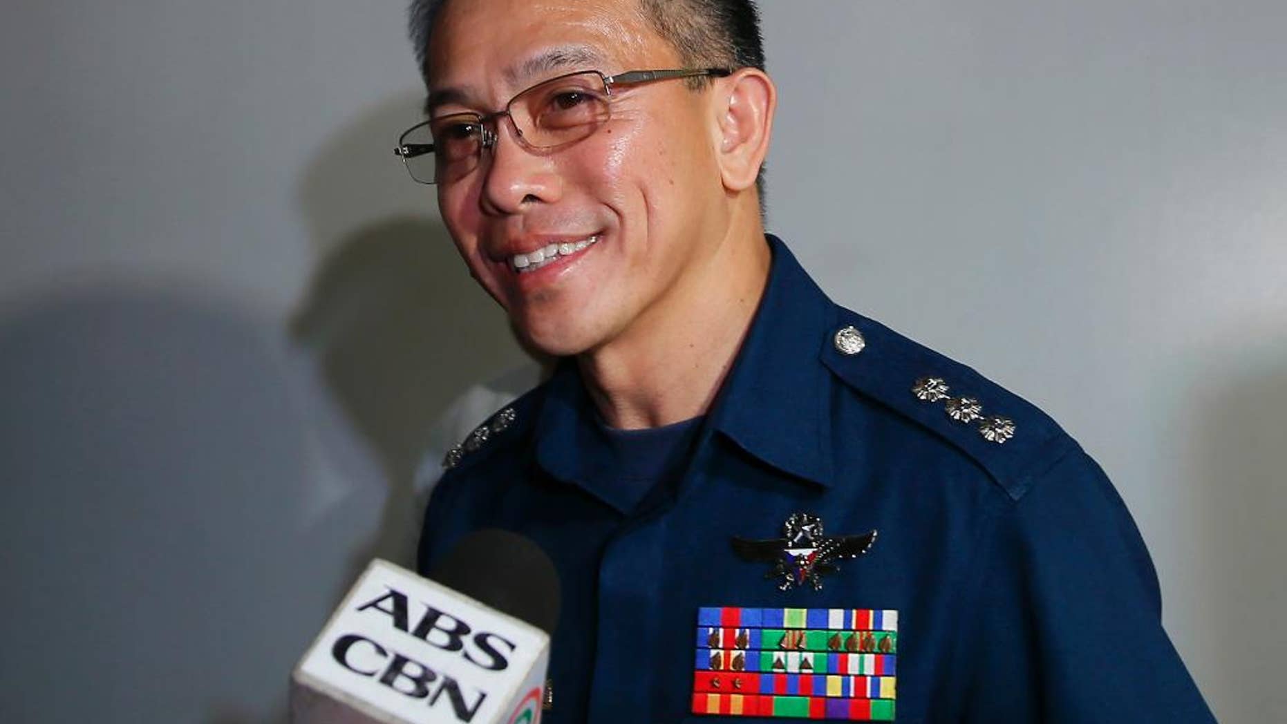 Col. Restituto Padilla, Spokesman of the Armed Forces of the Philippines, talks briefly to the media on the latest video of kidnapped Canadians, A Norwegian and a Filipino woman, as he arrives for a meeting with Foreign Affairs officials Wednesday, Nov. 4, 2015, 2015 at suburban Pasay city south of Manila, Philippines. Padilla refused to comment further except saying the military has seen the video. Suspected Abu Sayyaf gunmen have demanded more than $60 million for two Canadians and a Norwegian they are holding in the jungles of the southern Philippines in the largest ransom the Muslim militants have sought. In the video, which was circulated online by the U.S.-based SITE Intelligence Group, which monitors jihadi websites, the kidnappers and their captives say for the first time that the Abu Sayyaf was behind the Sept. 21 kidnappings. (AP Photo/Bullit Marquez)