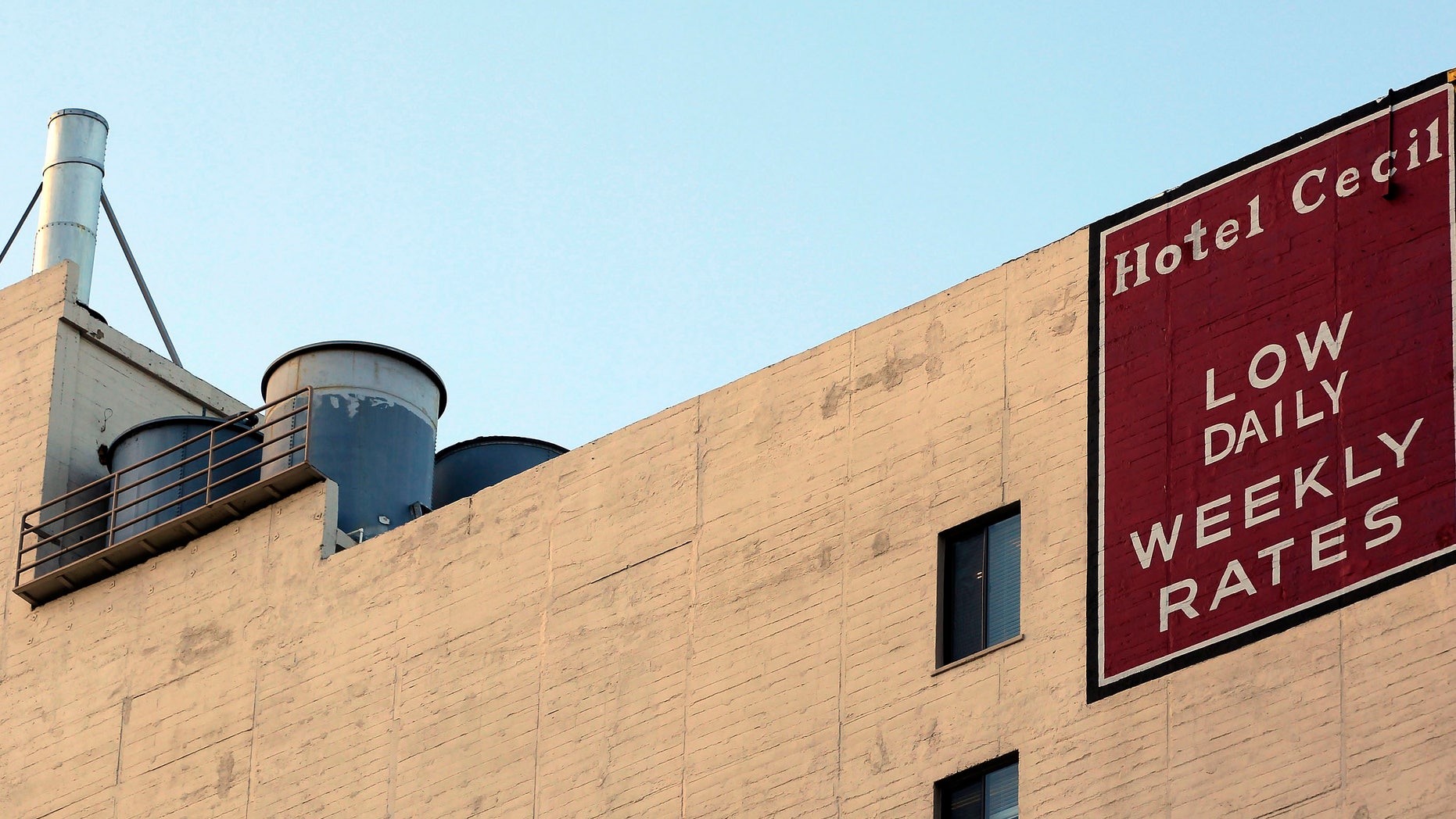 Water tanks seen on the roof of the hotel Cecil on Wednesday Feb. 20,2013 where police say the body of a woman found wedged in one of the water tanks on the roof was that of a missing Canadian guest. Investigators used body markings to identify 21-year-old Elisa Lam, police spokeswoman Officer Diana Figueroa said late Tuesday. A maintenance worker at the Cecil Hotel found the body earlier in the day after guests complained of low water pressure. (AP Photo/Nick Ut)