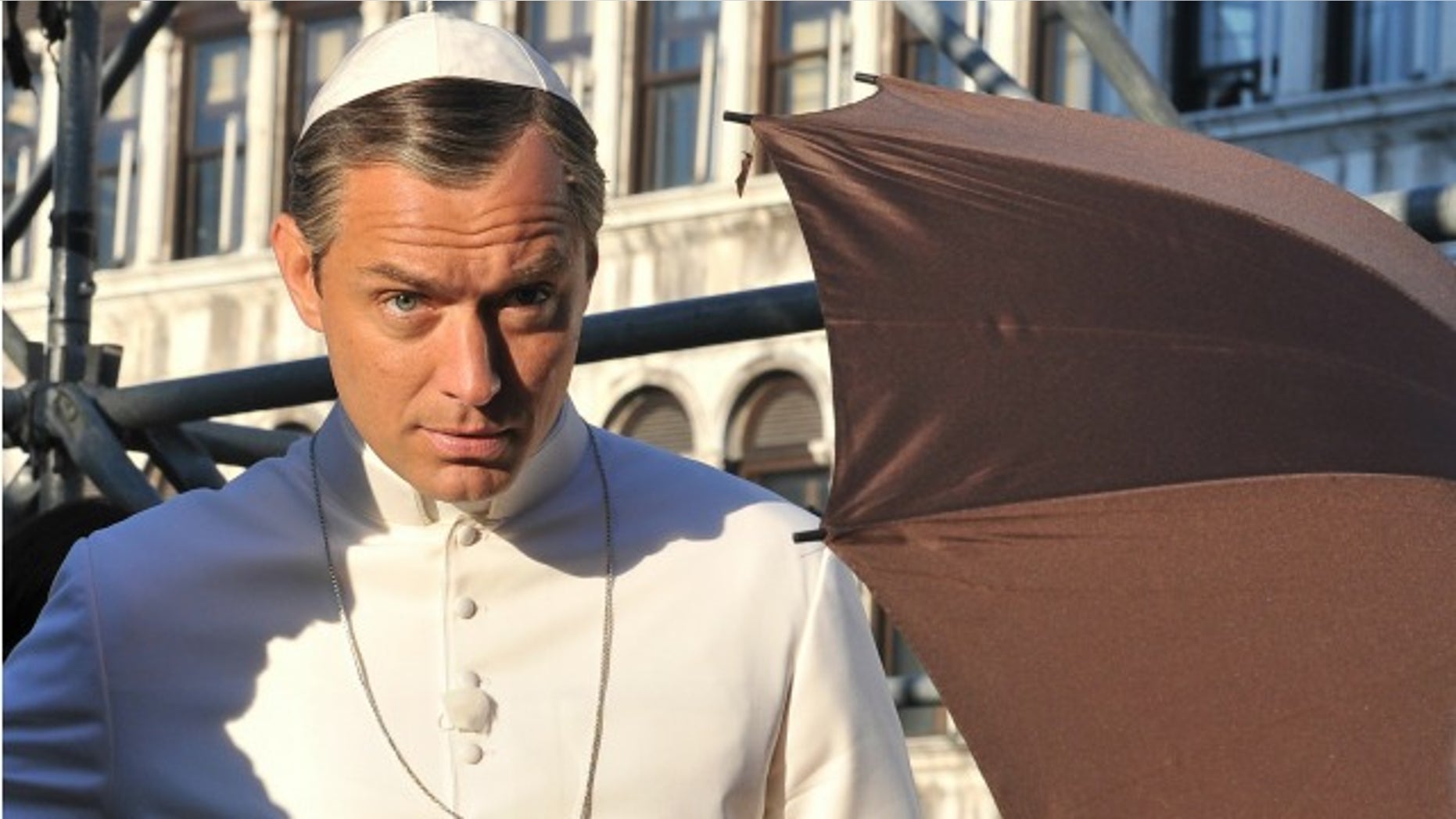 Actor Jude Law is seen on the set of Italian director Paolo Sorrentino's TV series "The Young Pope", in Venice's St. Mark's Square, Italy, Tuesday, Jan. 12, 2016. Law plays the part of a fictional Pope Pius XIII as the first American pope. (AP Photo/Luigi Costantini)