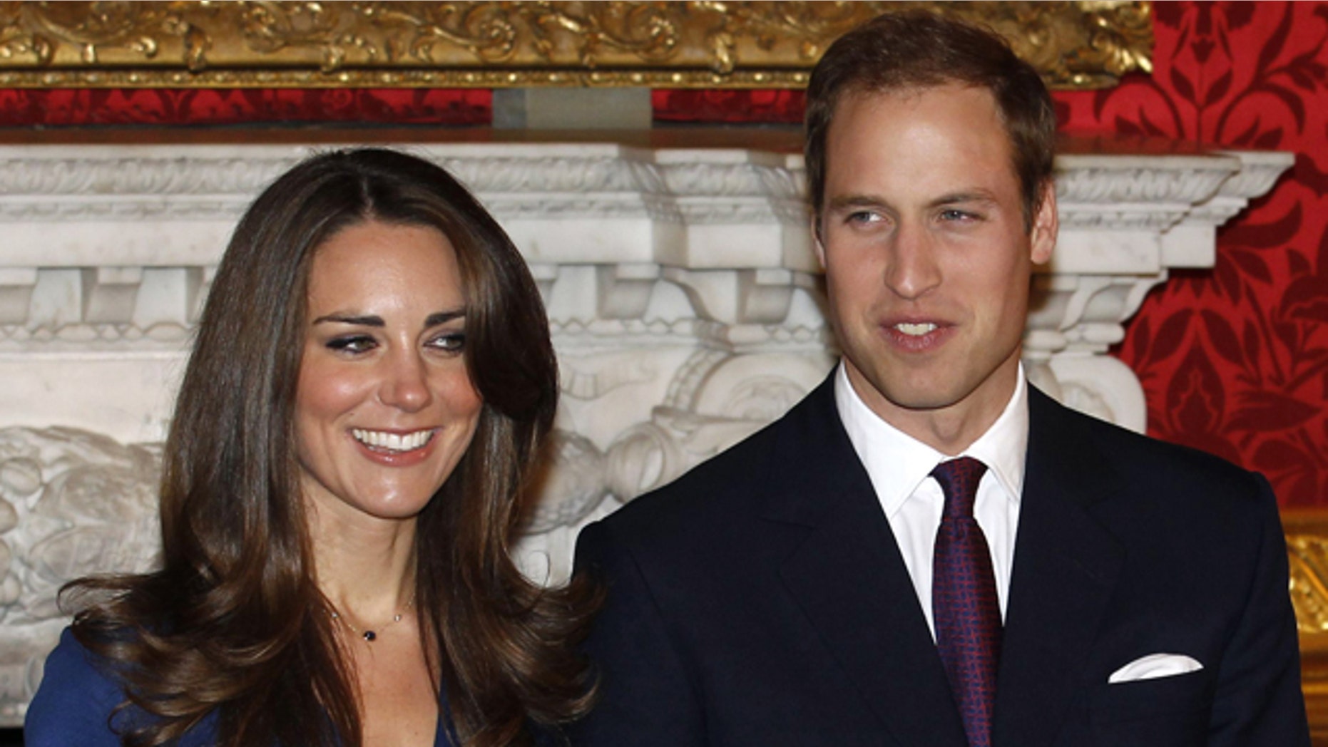 Britain's Prince William and his fiancee Kate Middleton pose for a photograph in St. James's Palace in central London
