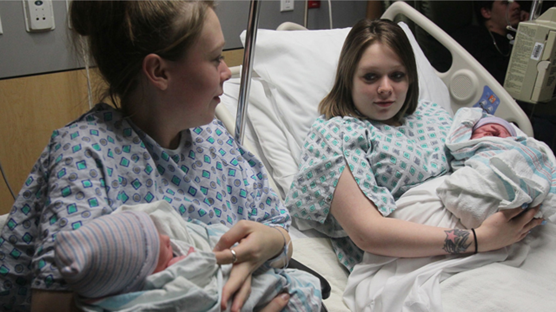 Dec. 31, 2012: Twin mothers Aimee, left, and Ashlee Nelson hold their newborn sons Donavyn Bratten, left, and Aiden Lee Alan Dilts at Summa Akron City Hospital.