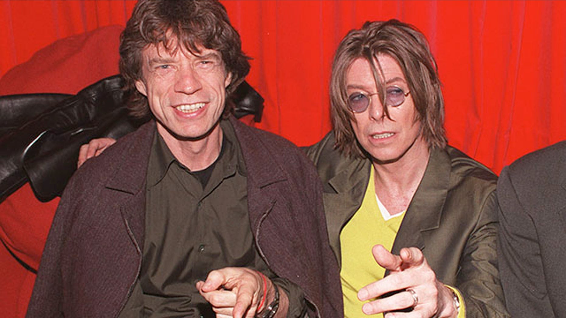 December 2, 1999. Singers David Bowie (R) and Mick Jagger (L) at POP in Soho, London.