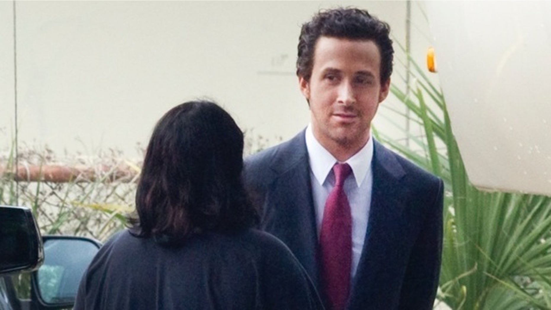 EXCLUSIVE: Ryan Gosling is a dark haired city slicker on set in New Orleans. The actor transformed into a tanned, slick dark haired businessman as he worked on his latest movie The Big Short in New Orleans, which co-stars Brad Pitt, Christian Bale and Steve Carell.