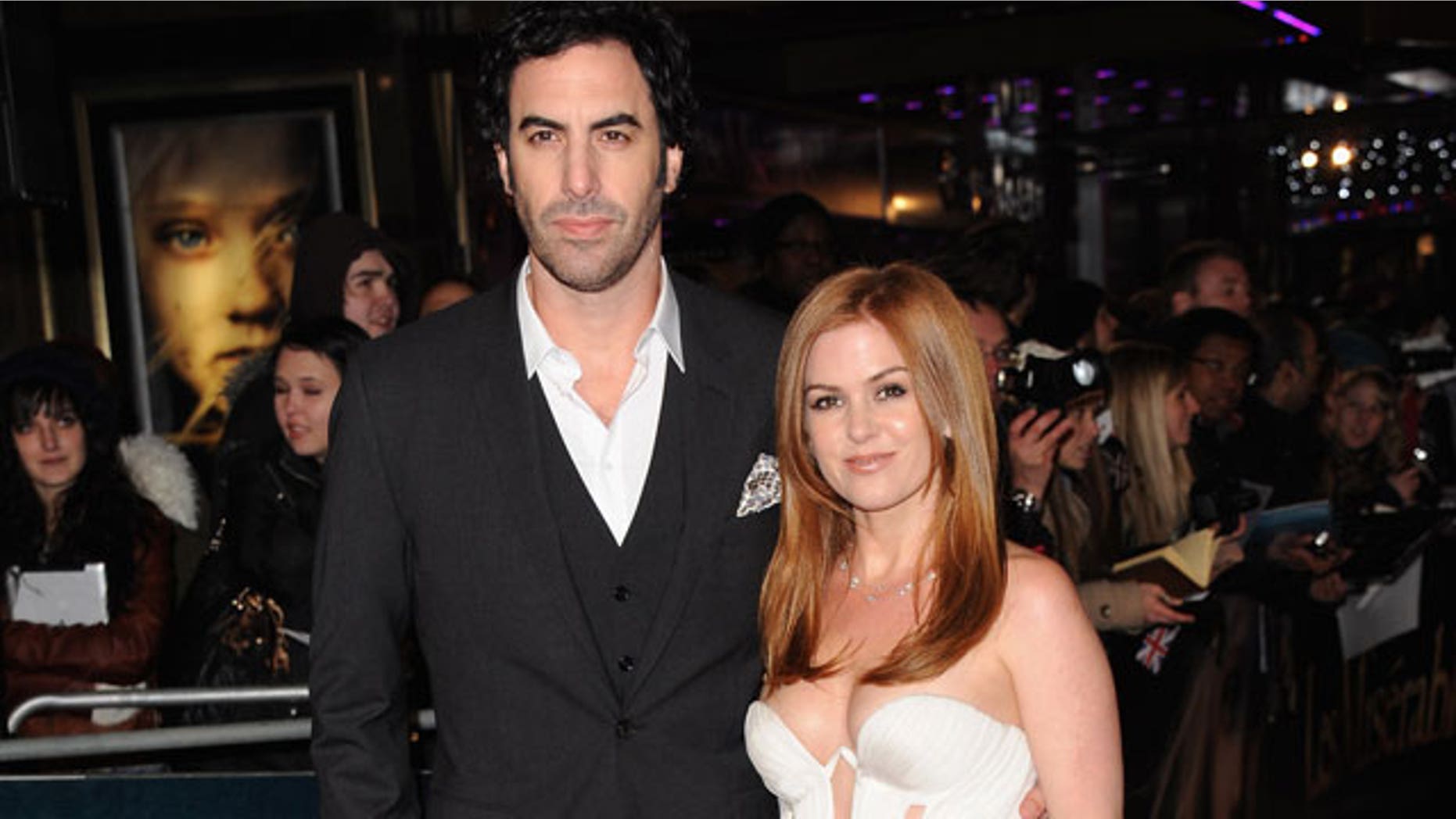 Ted Koppel says Sacha Baron Cohen, shown with wife Isla Fisher, duped him into an interview.