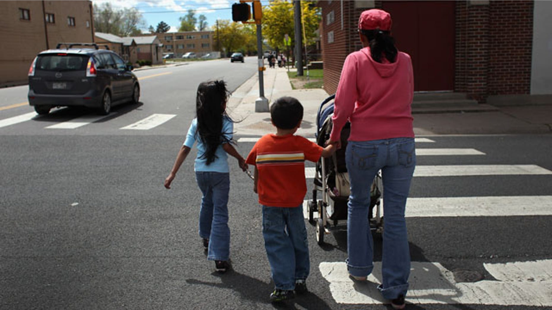 AURORA, CO - MAY 21: Undocumented Mexican immigrant Jeanette Vizguerra walks home with her three American-born children on May 21, 2011 in Aurora, Colorado. Vizguerra is facing deportation to Mexico and is scheduled for a final hearing July 13 at Denver's Federal Courthouse. Just one of millions of undocumented immigrants living in the United States, Vizguerra first came to Colorado from Mexico City with her husband 14 years before. She is a small business owner of a janitorial service and a community organizer for immigration rights. Stopped two years ago by a traffic policemen for driving with expired tags, Vizguerra was taken to jail when she could not prove she was in the country legally. Out on bail during lengthy court proceedings, she now faces the real possibility that she will be deported back to Mexico and separated from her family in the United States. (Photo by John Moore/Getty Images)