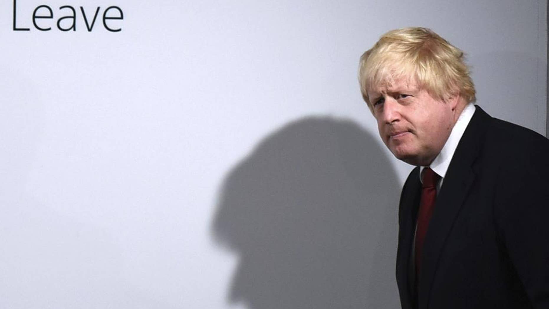 FILE - In this Friday, June 24, 2016 file photo, Vote Leave campaigner Boris Johnson arrives for a press conference at Vote Leave headquarters in London . In the crucial days before Foreign Secretary Boris Johnson embraced Britain’s “leave campaign,” he wrote a newspaper column explaining why Britain should remain inside the European Union _ but those forceful words were never published before Britain’s June 23 vote. The Sunday Times has now published Johnson’s pro-EU column, which outlines his fears about leaving the EU on SUnday, Oct. 16, 2016. (Mary Turner/Pool via AP, File)