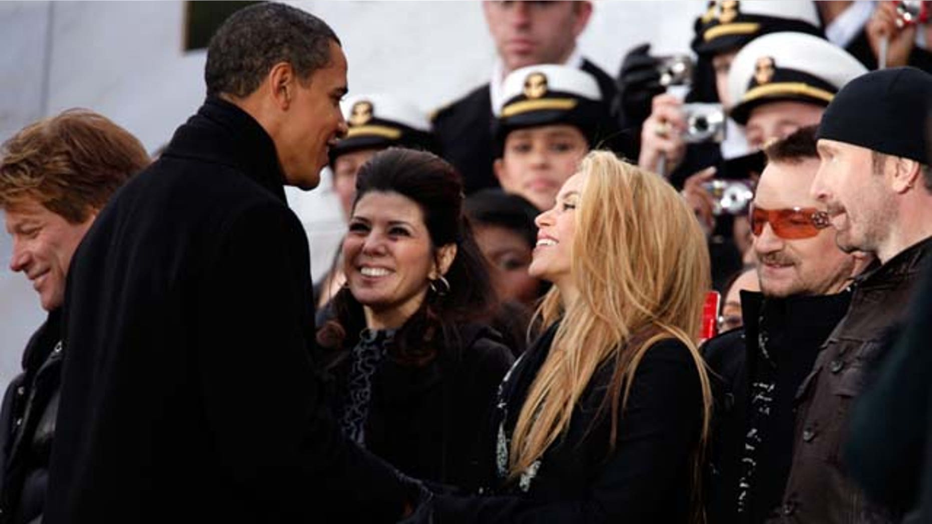 January 18, 2009: U.S. President-elect Barack Obama shakes hands with Shakira and Marisa Tomei, Bono and the Edge in front of the Lincoln Memorial during the 'We Are One: The Obama Inaugural Celebration At The Lincoln Memorial' at the National Mall in Washington, DC. The event includes a diverse array of talent featuring both musical performances and historical readings and an appearance by U.S. President-elect Barack Obama.
