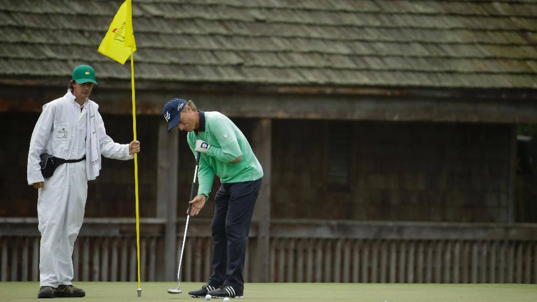 Bernhard Langer, of Germany, putts on the 11th green during a practice round for the Masters golf tournament Tuesday, April 8, 2014, in Augusta, Ga. (AP Photo/Chris Carlson)