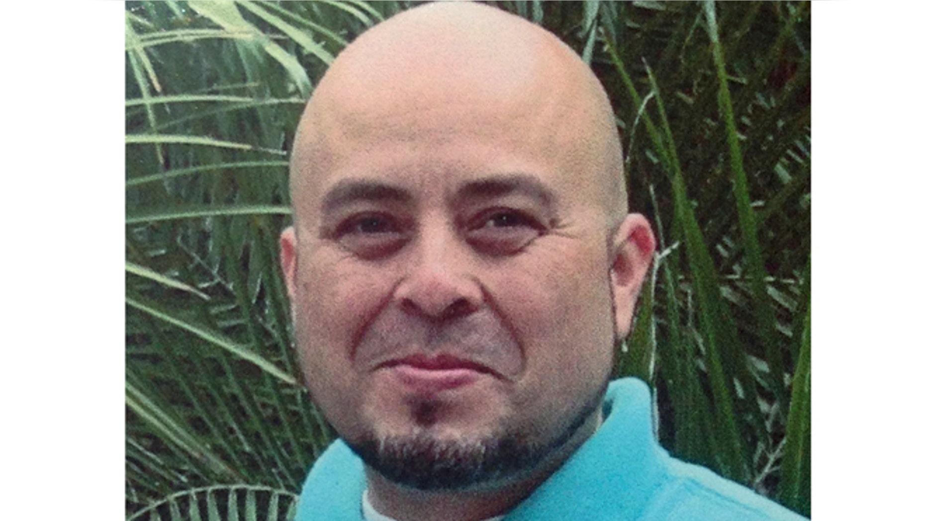 This June 2013 file photo released by the Hernandez family Nov. 2, 2013, shows Transportation Security Administration officer Gerardo Hernandez.