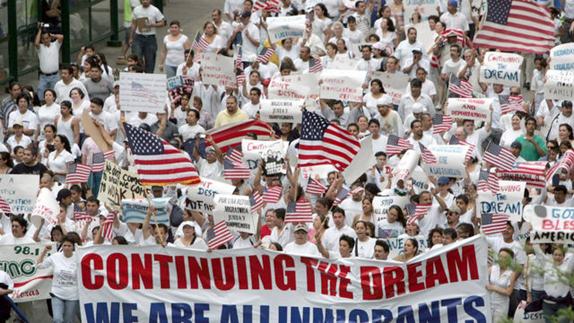 Marchers in support of immigration reform walk the streets of Indianapolis, Tuesday, May 1, 2007. Marches and rallies took place in dozens of cities across the United States. (AP Photo/AJ Mast)