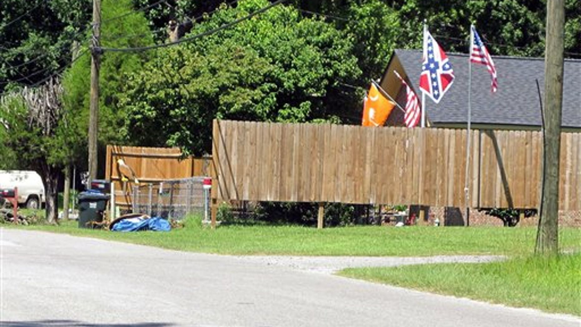 In this Sept. 8, 2011, photo, the Confederate flag is displayed on a pole outside Annie Chambers Caddel's home in Summerville, S.C.