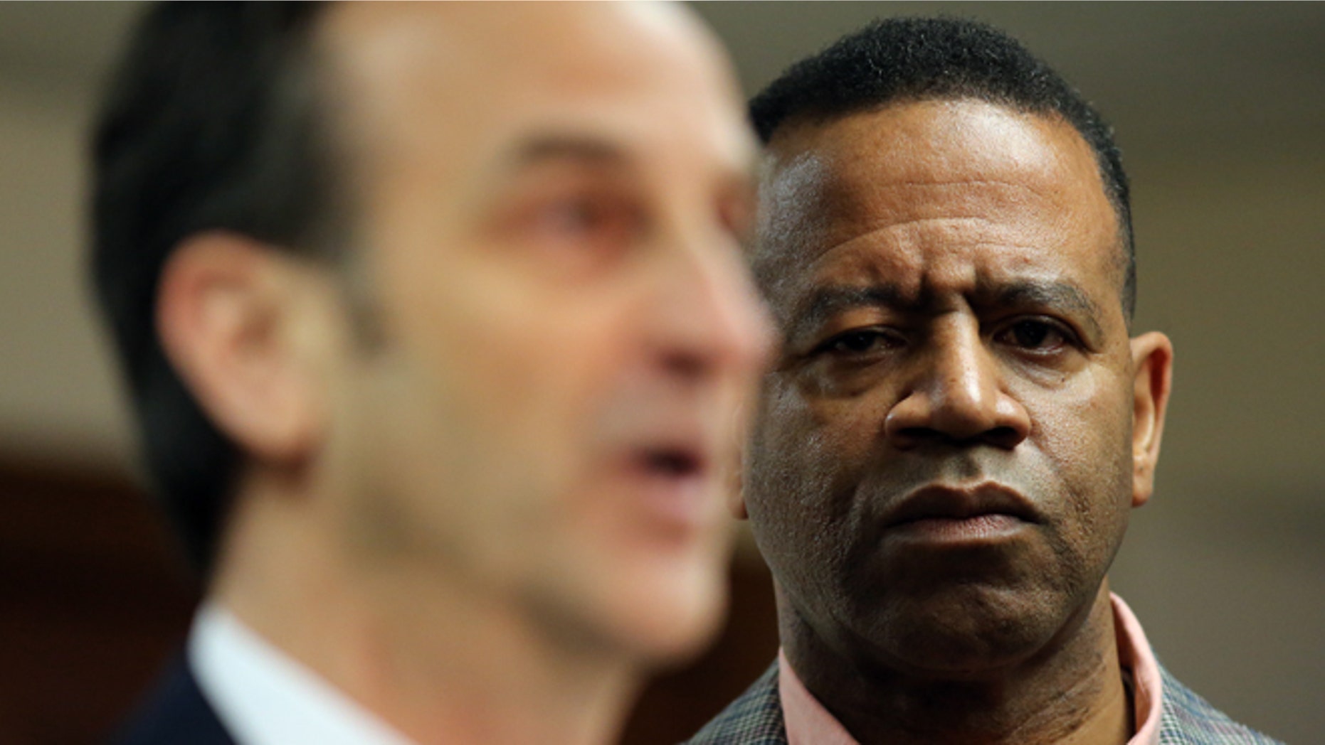 Feb. 18, 2015: Kelvin Cochran, right,who was fired from his position as Atlanta Fire Chief, listens as his attorney David Cortman answers questions at a press conference where he and his attorney announced that they had filed a federal lawsuit against the City of Atlanta.