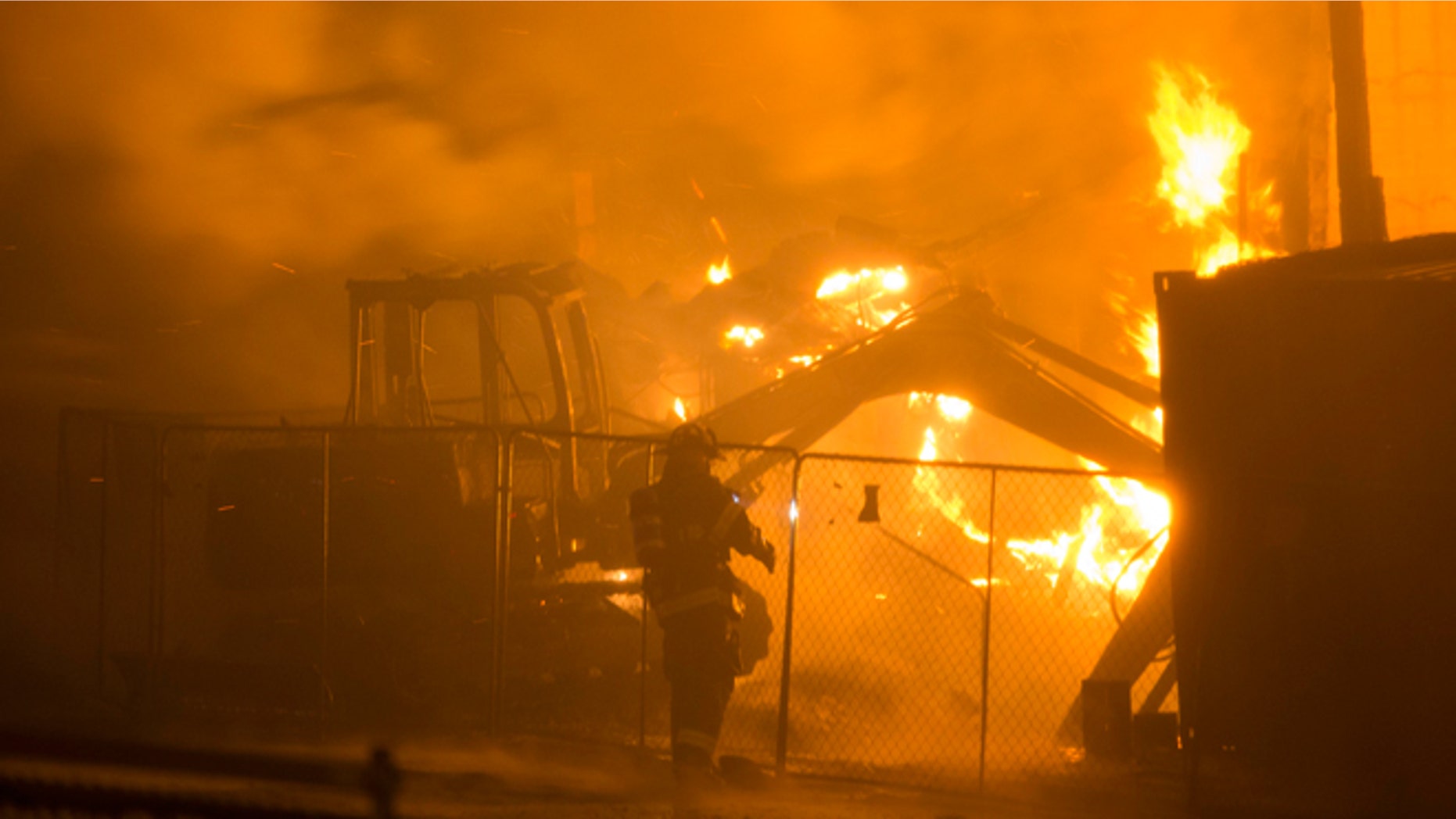 April 27, 2015: Firefighters battle a blaze after rioters plunged part of Baltimore into chaos, torching a pharmacy, setting police cars ablaze and throwing bricks at officers.