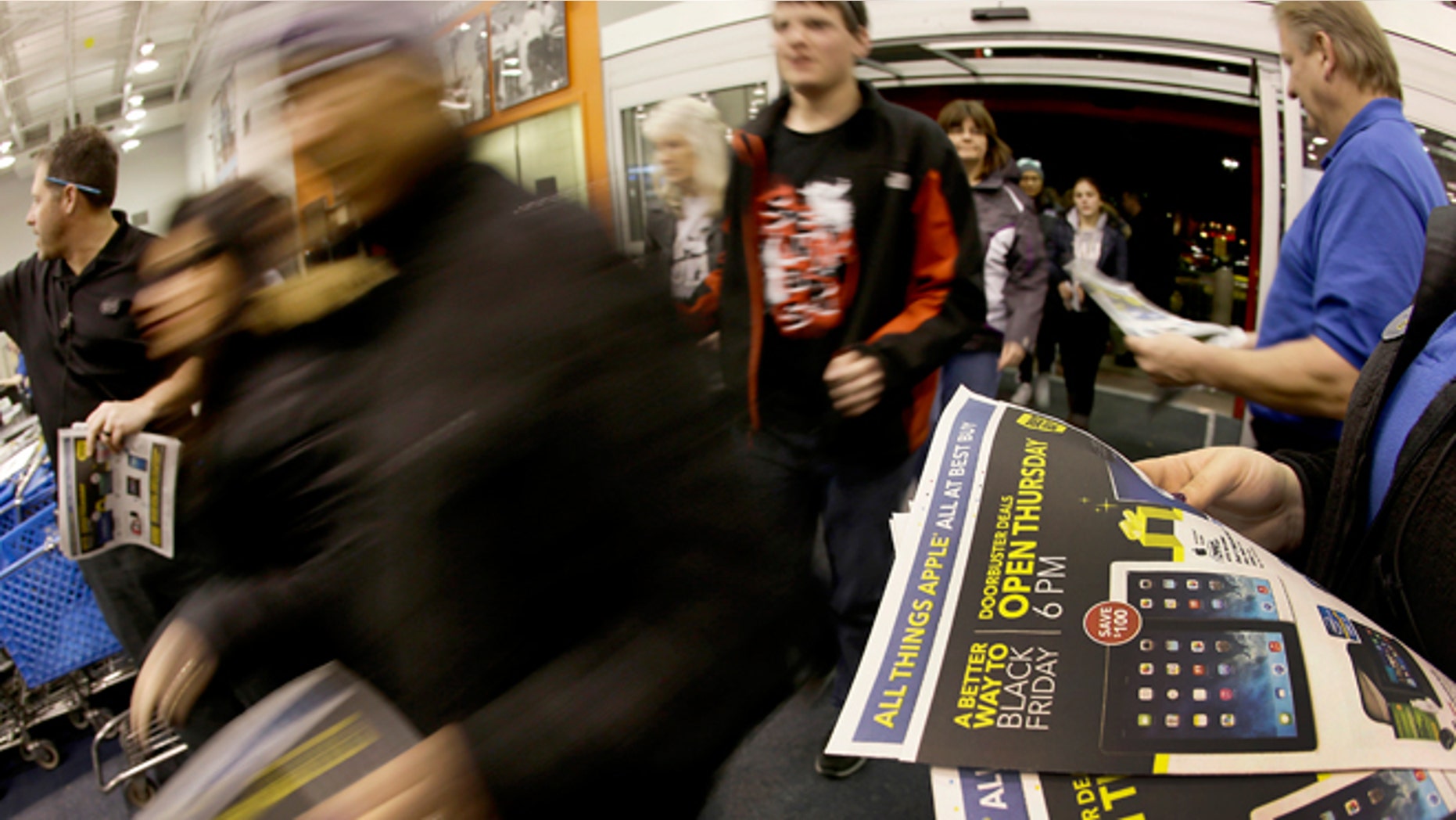 FILE - Thursday, Nov. 28, 2013: Shoppers enter a Best Buy as the store opens on Thanksgiving Day in Overland Park, Kansas.