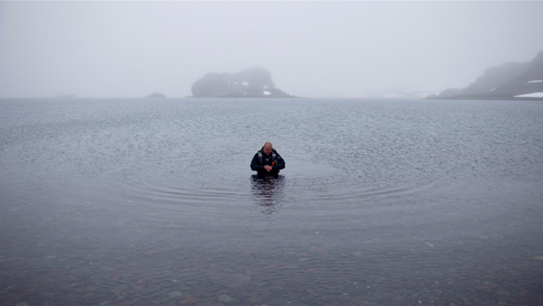 FILE -- Jan. 21, 2015: Scuba diver Luis Torres tests the water at Chilean scientific station Escudero at Villa Las Estrellas, in King George Island, in the South Shetland Islands archipelago of Antarctica.