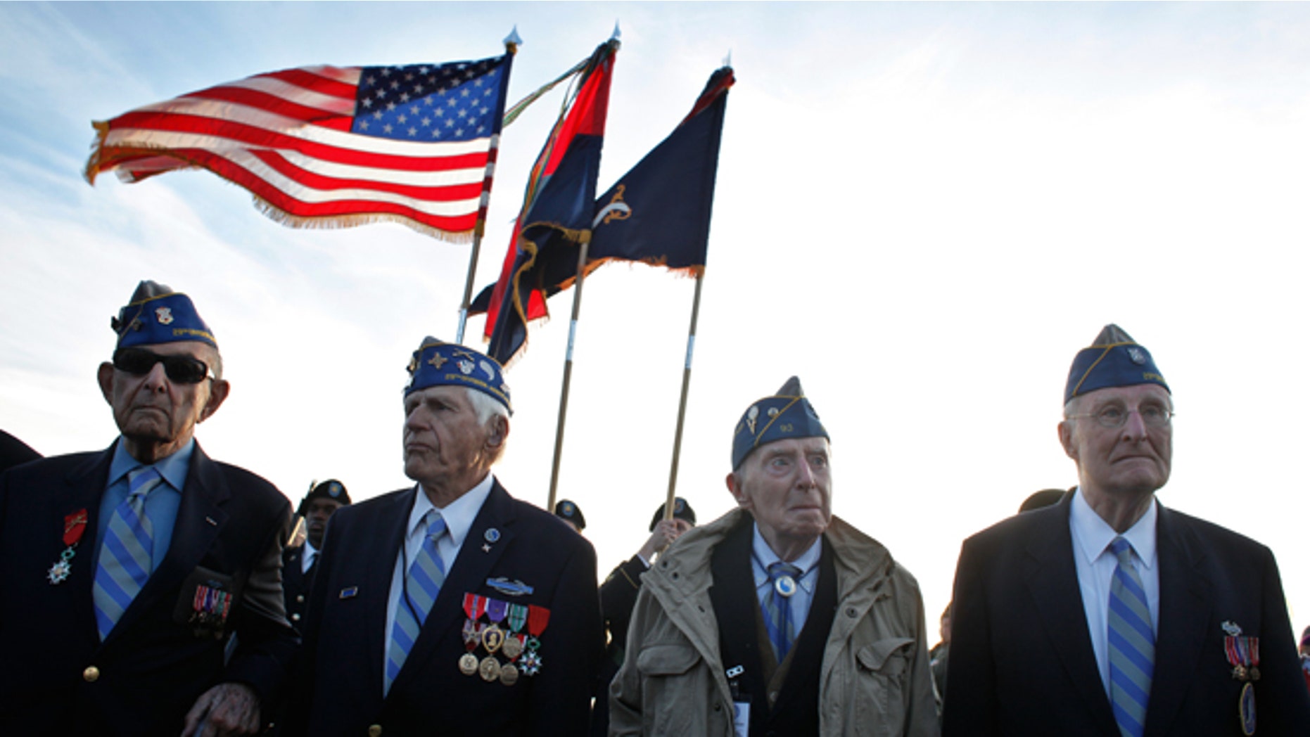 June 6, 2014: From left, World War II veterans of the U.S. 29th Infantry Division, Hal Baumgarten, 90 from Pennsylvania, Steve Melnikoff, 94, from Maryland, Don McCarthy, 90 from Rhode Island, and Morley Piper, 90, from Massachusetts, attend a D-Day commemoration, on Omaha Beach, western France.