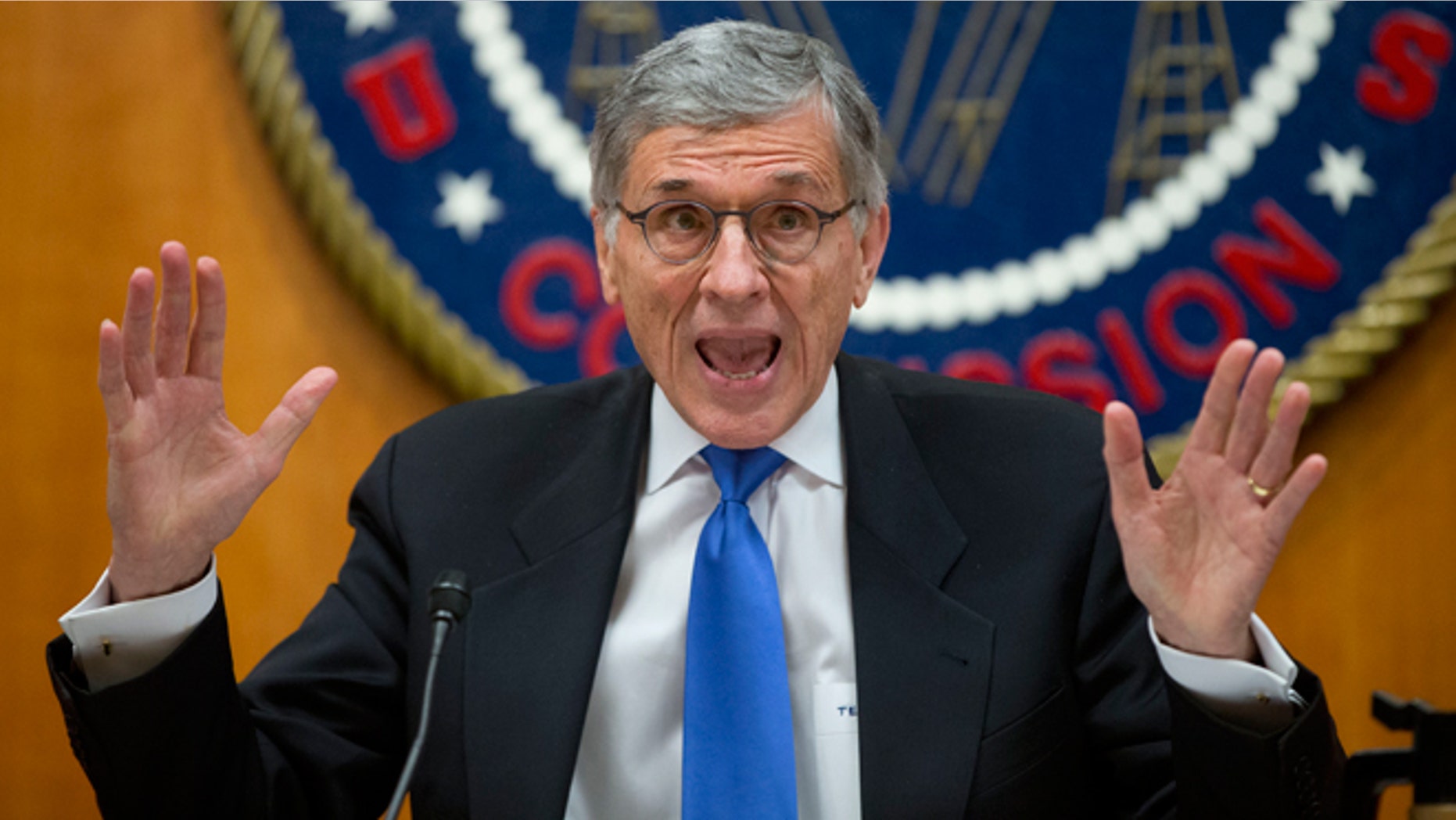 FILE -- Feb. 26, 2015: Federal Communications Commission (FCC) Chairman Tom Wheeler gestures near the end of a hearing for a vote on Net Neutrality at the FCC in Washington. Internet activists scored a major victory after the Federal Communications Commission agreed to rules that would ban service providers from creating Internet fast lanes.