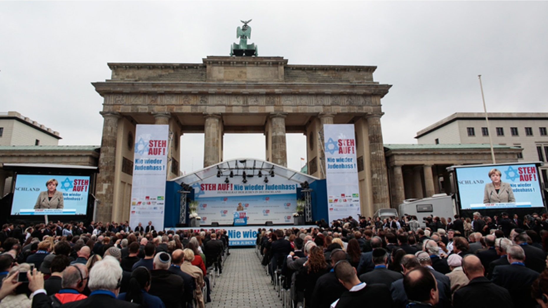 Sept. 14, 2014: German Chancellor Angela Merkel delivers her speech at a rally against anti-Semitism near the Brandenburg Gate in Berlin. Thousands of protesters attended the public rally organized by Germany’s Jewish community at the capital’s Brandenburg Gate after tensions over the Gaza conflict spilled over into demonstrations in Europe that saw anti-Jewish slogans and violence. The slogan reads: Stand Up! - Jew hatred - never again!', and the name of the organizer: Central Council of Jews in Germany.