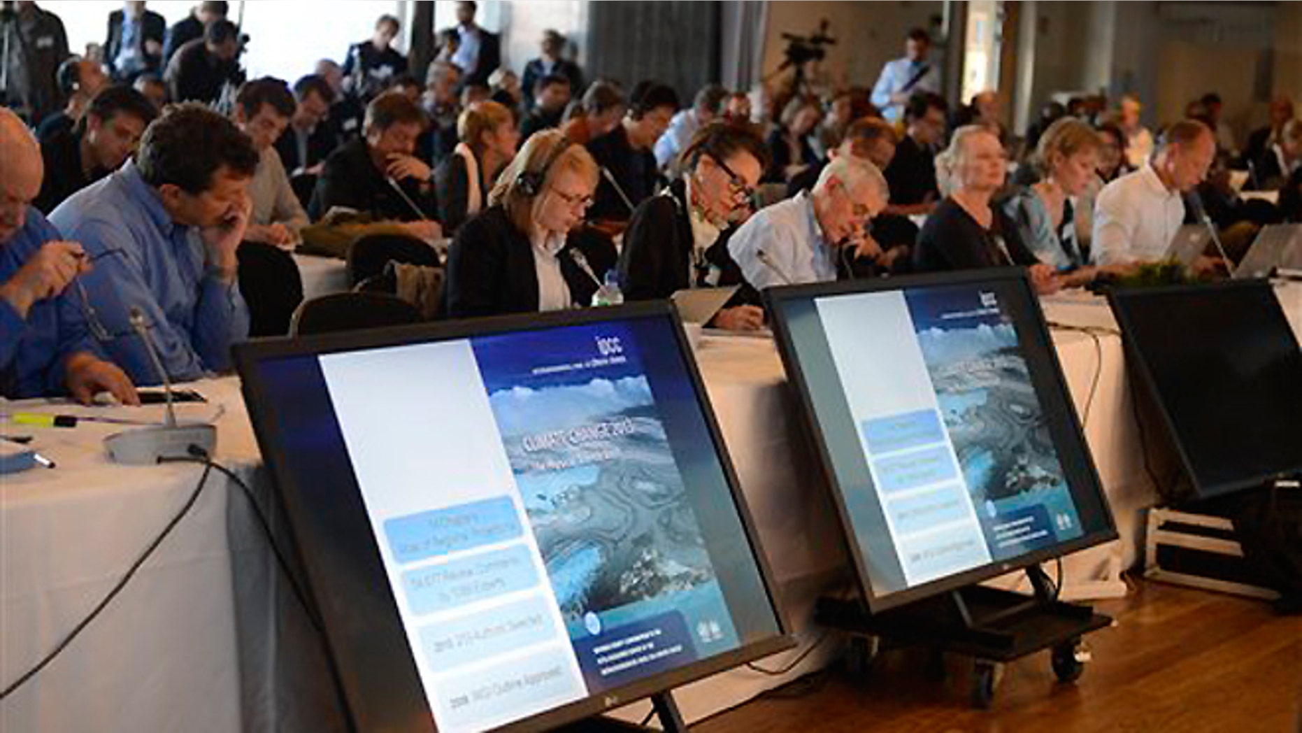 Sept. 27, 2013: Media representatives follow the U.N. IPCC climate report presentation, in Stockholm.