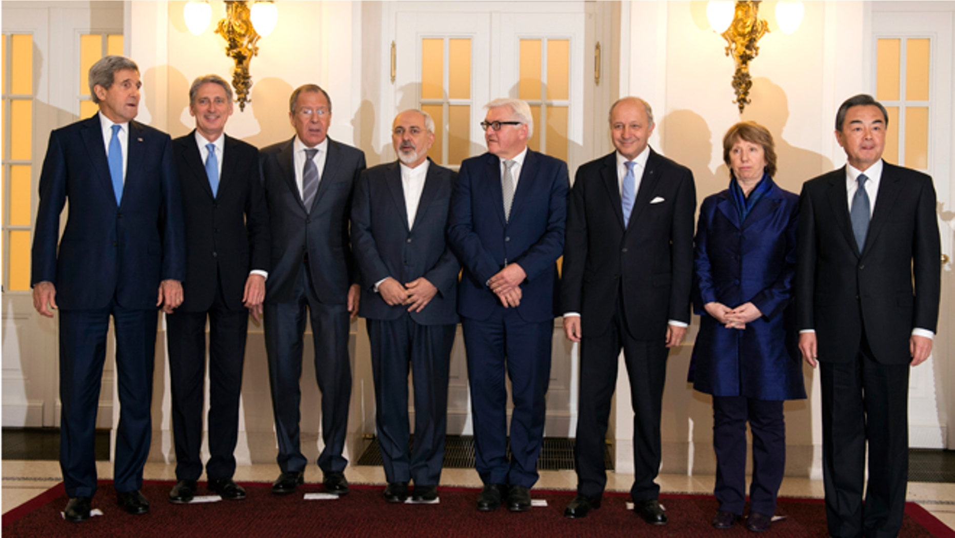 Nov. 24, 2014:U.S. Secretary of State John Kerry, Britain's Foreign Secretary Philip Hammond, Russian Foreign Minister Sergey Lavrov, Iranian Foreign Minister Mohammad Javad Zarif, German Foreign Minister Frank-Walter Steinmeier, French Foreign Minister Laurent Fabius, former EU foreign policy chief Catherine Ashton and Chinese Foreign Minister Wang Yi pose for a group photo during their meeting in Vienna.