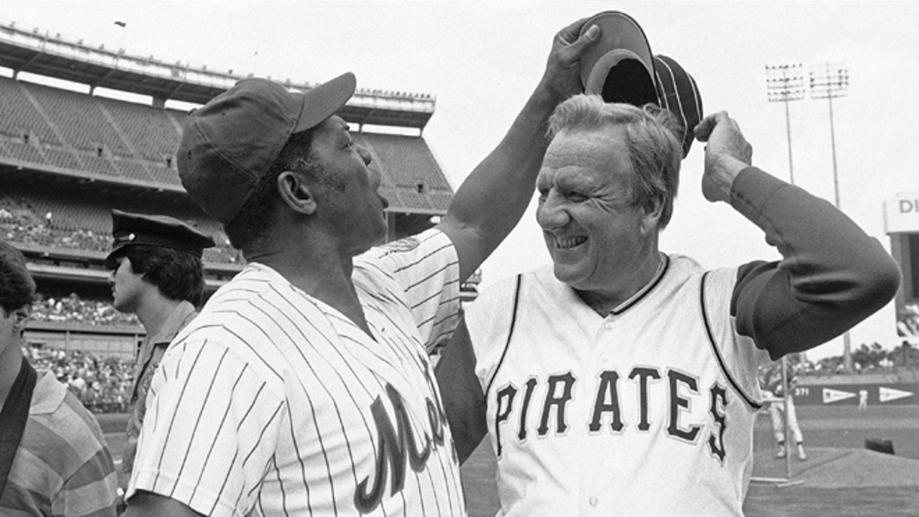 FILE - In this Aug. 14, 1982 file photo, Willie Mays tries to get Ralph Kiner's hat as the two Hall of Famers pose for pictures before the start of Old Timers Day game at Shea Stadium in New York. The baseball Hall of Fame slugger died on Feb. 6, 2014, at his home in Rancho Mirage, Calif. He was 91.
