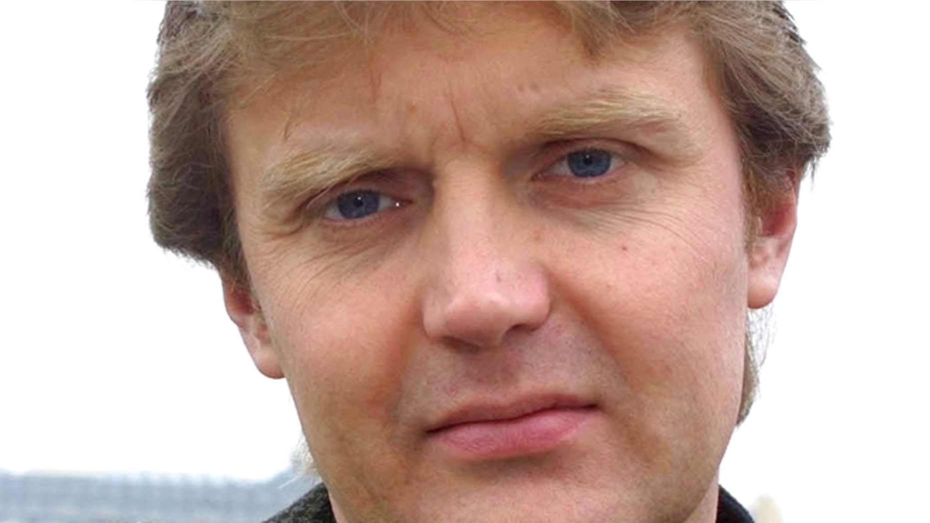FILE -- May 10, 2002 file photo of Alexander Litvinenko, Kremlin critic and author of the book "Blowing Up Russia: Terror From Within", photographed at his home in London . The coroner examining the poisoning death of ex-KGB officer Alexander Litvinenko says the question of whether the Russian state was responsible will be withdrawn from the scope of the inquiry. In a ruling Thursday Dec. 19, 2013, Robert Owen also says he will not examine whether Britain was aware of any risks to Litvinenko's life and failed to take reasonable steps to protect him before he died after drinking tea laced with the radioactive isotope polonium-210.