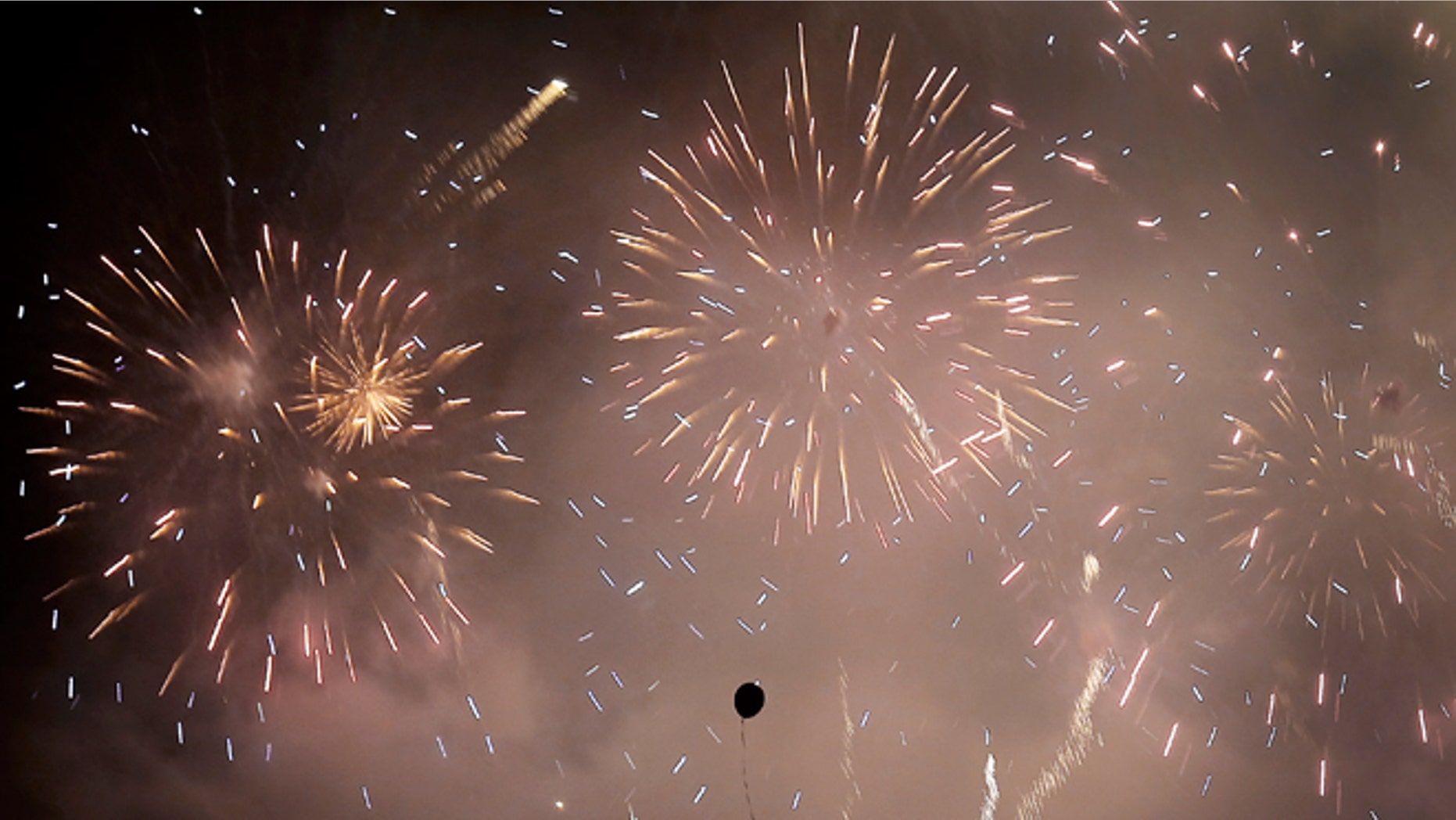 Jan. 1, 2014 -- Fireworks explode over the financial district in Singapore.