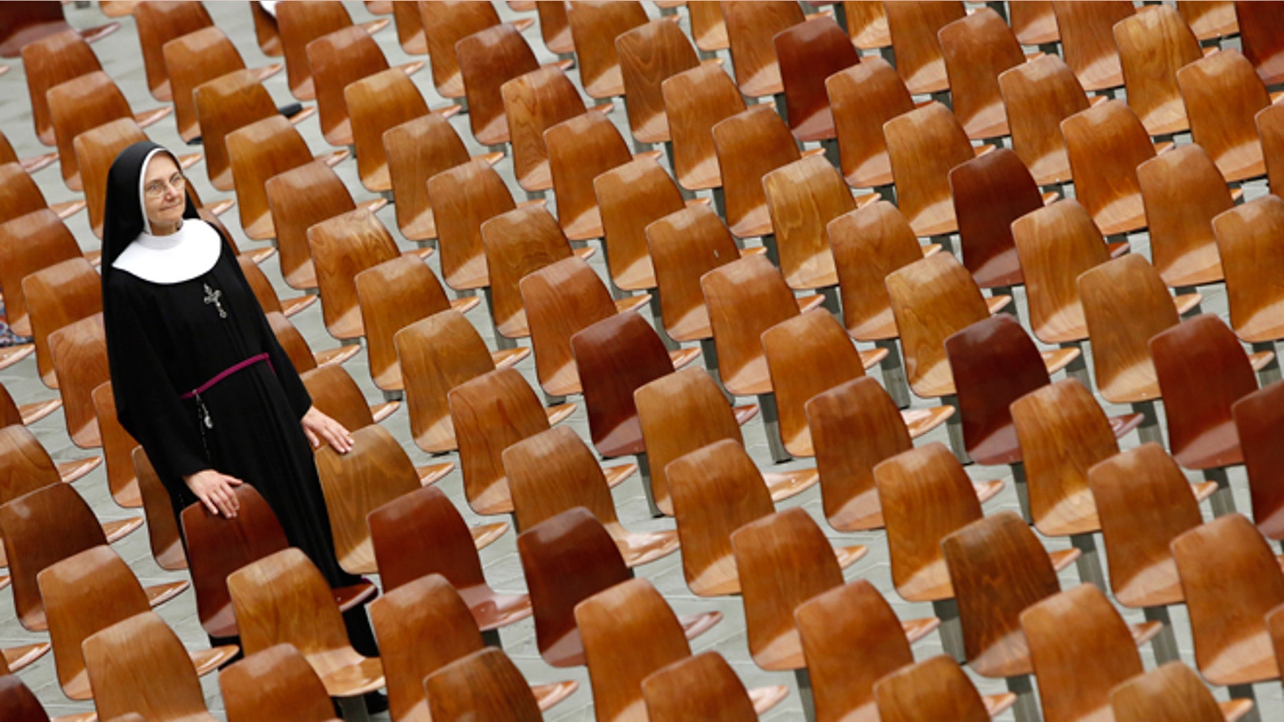 Aug. 20, 2014: A nun waits to greet Pope Francis at the end of his weekly general audience in the Paul VI hall, at the Vatican.