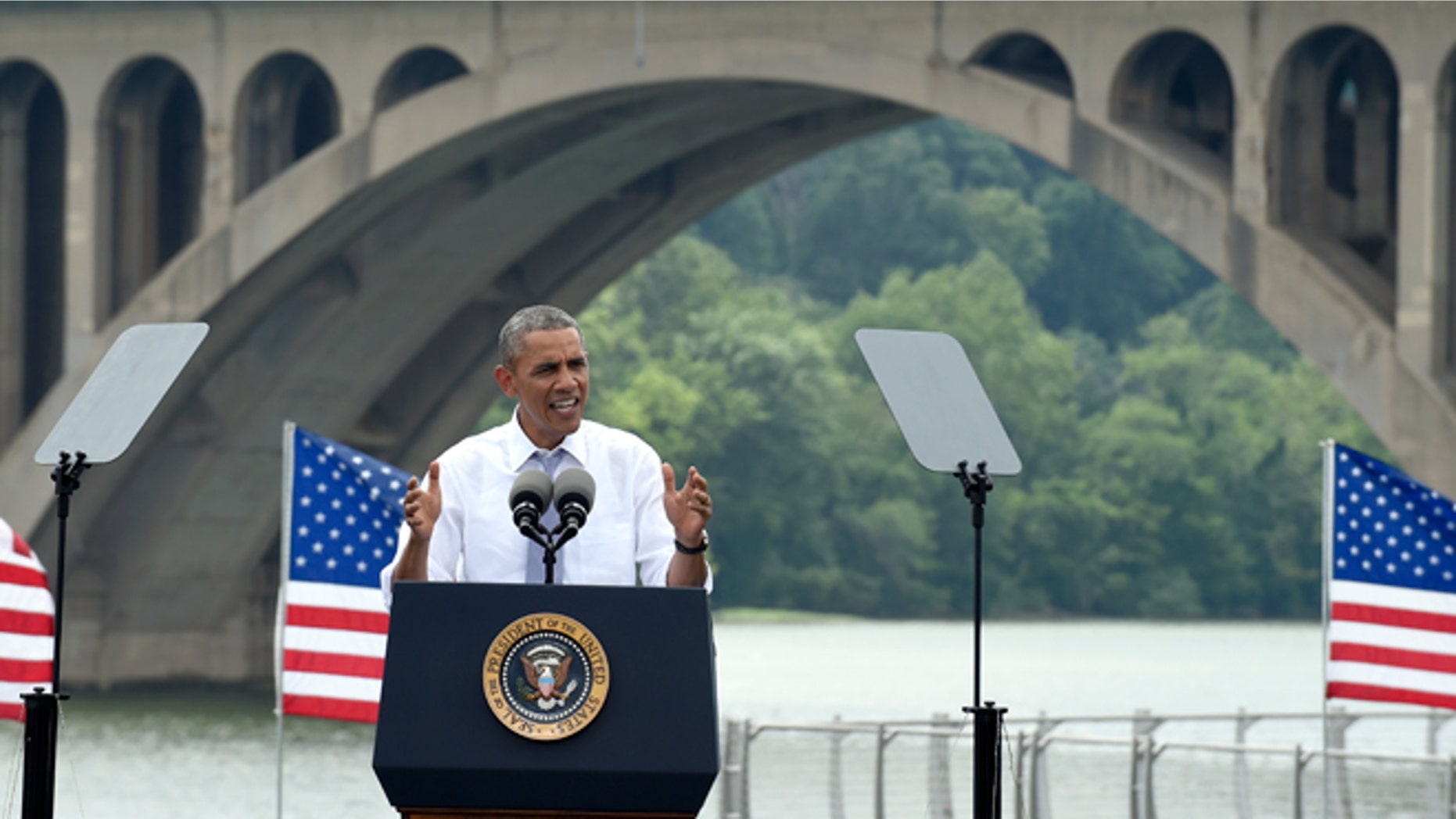 July 1, 2014: With the Key Bridge, linking Washington and Northern Virginia in the background, President Barack Obama speaks about the economy and transportation, at Georgetown Waterfront Park in Washington. The president said 700,000 jobs could be at risk next year if Congress doesn't quickly agree on how to pay for highway and transit programs.