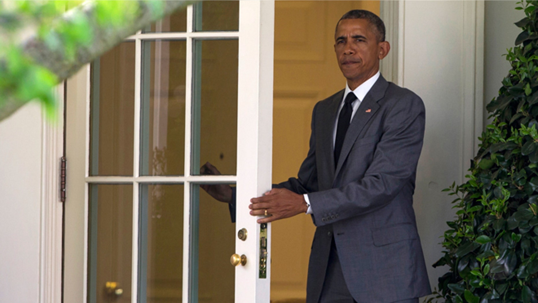 April 29, 2015: President Obama walks out of the Oval Office of the White House in Washington to board Marine One on the South Lawn for a trip to Walter Reed National Military Medical Center to meet with wounded veterans.