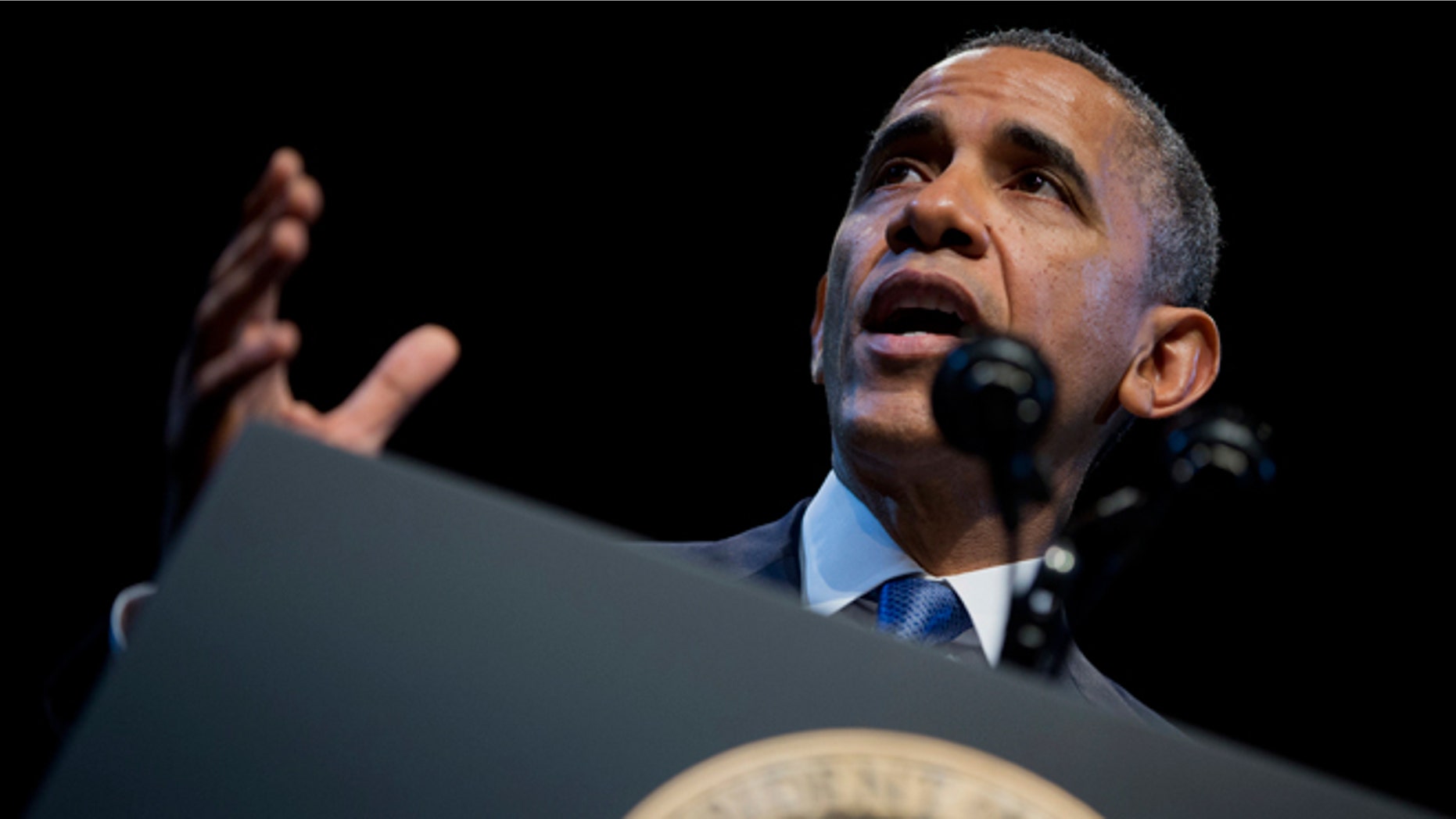 FILE - Dec. 4, 2013: President Obama speaks about the economy and growing economic inequality, at the Town Hall Education Arts Recreation Campus in Washington. The president said the income gap between America's rich and poor is a "defining challenge of our time."