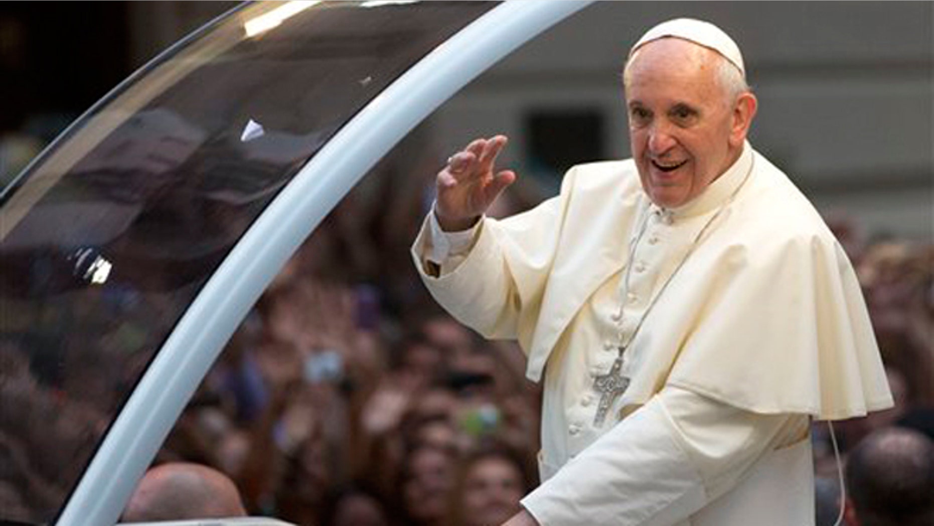FILE -- July 22, 2013: Pope Francis waves to crowds in Rio de Janeiro, Brazil.
