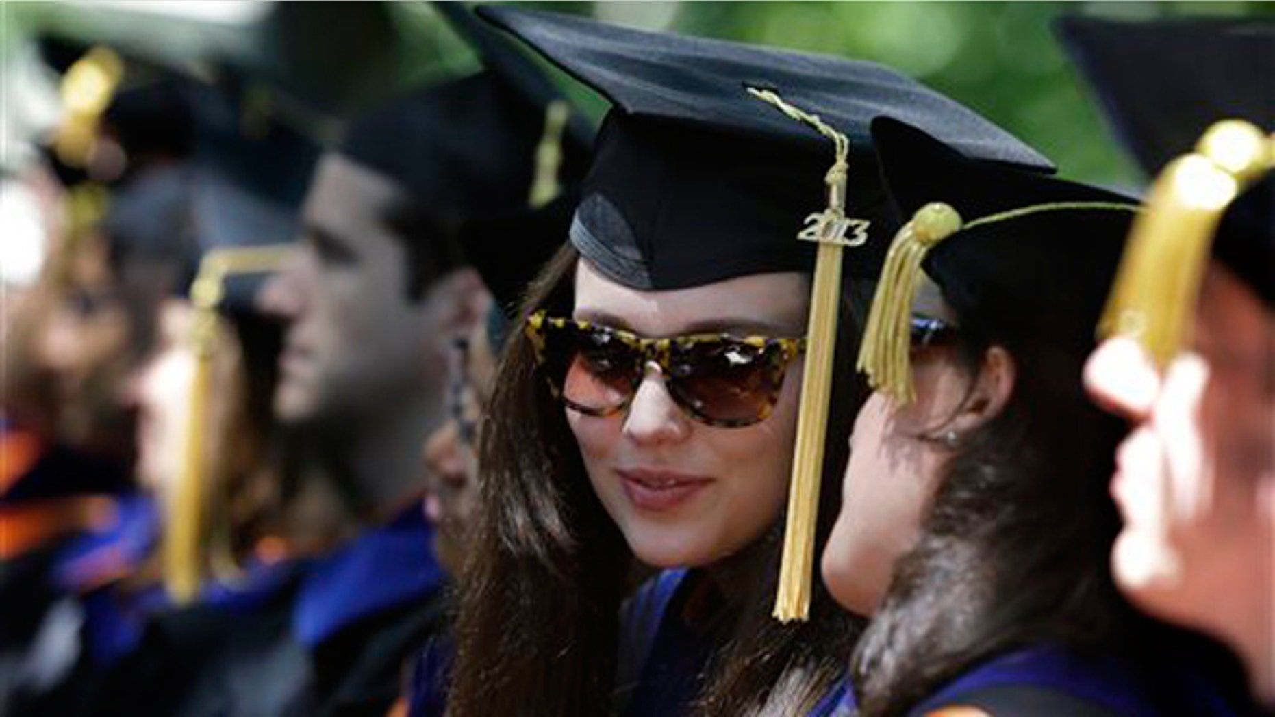 FILE -- June 4, 2013: Students talk during Princeton University's graduation ceremonies in Princeton, N.J. Princeton awarded degrees to 2,158 undergraduate and graduate students.