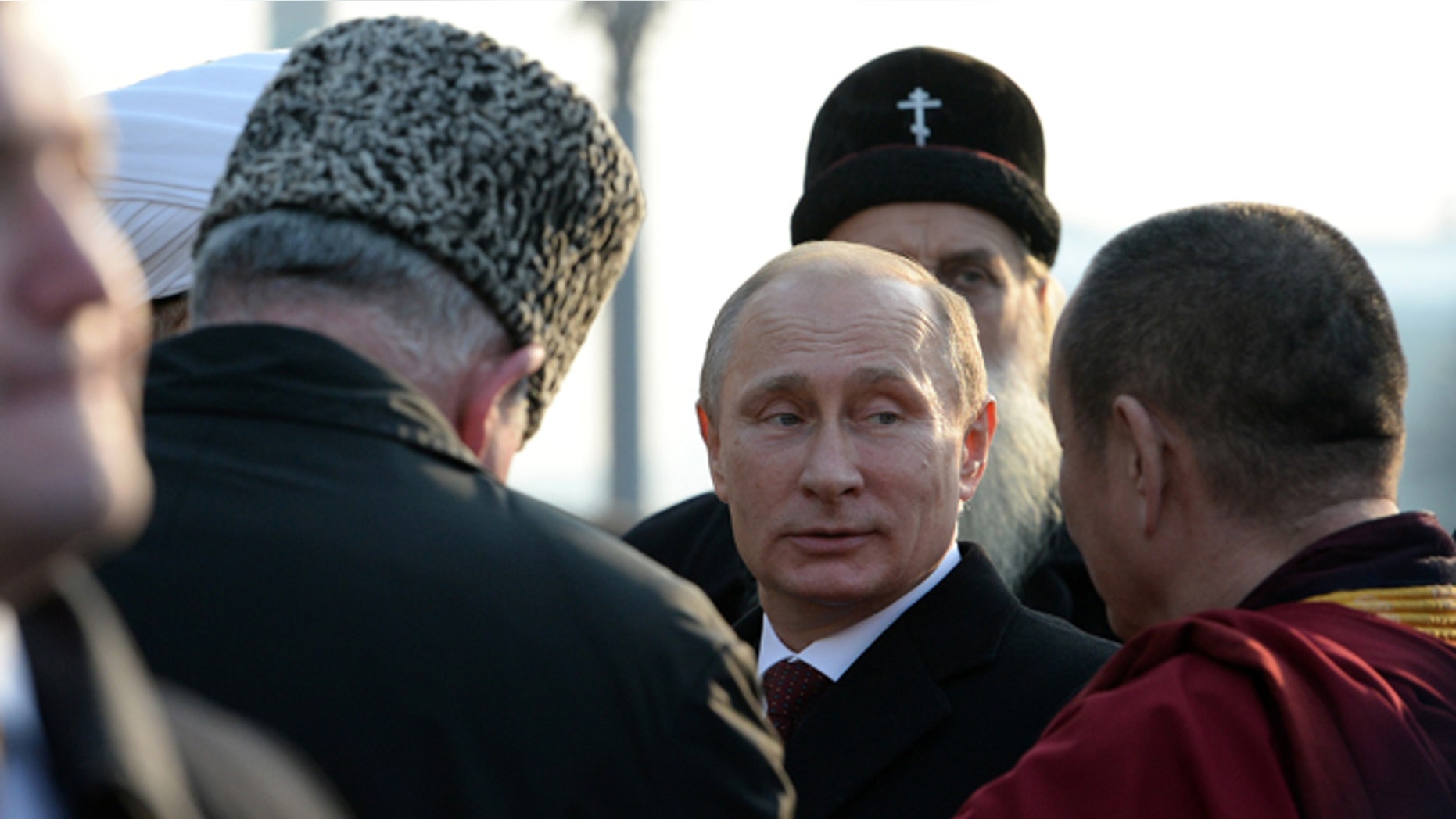 Nov. 4, 2014: Russian President Vladimir Putin, center, speaks with the confessional leaders during a ceremony at the Red Square in Moscow on National Unity Day, a national holiday which this year marks the 402th anniversary of the 1612 expulsion of Polish occupiers from the Kremlin.