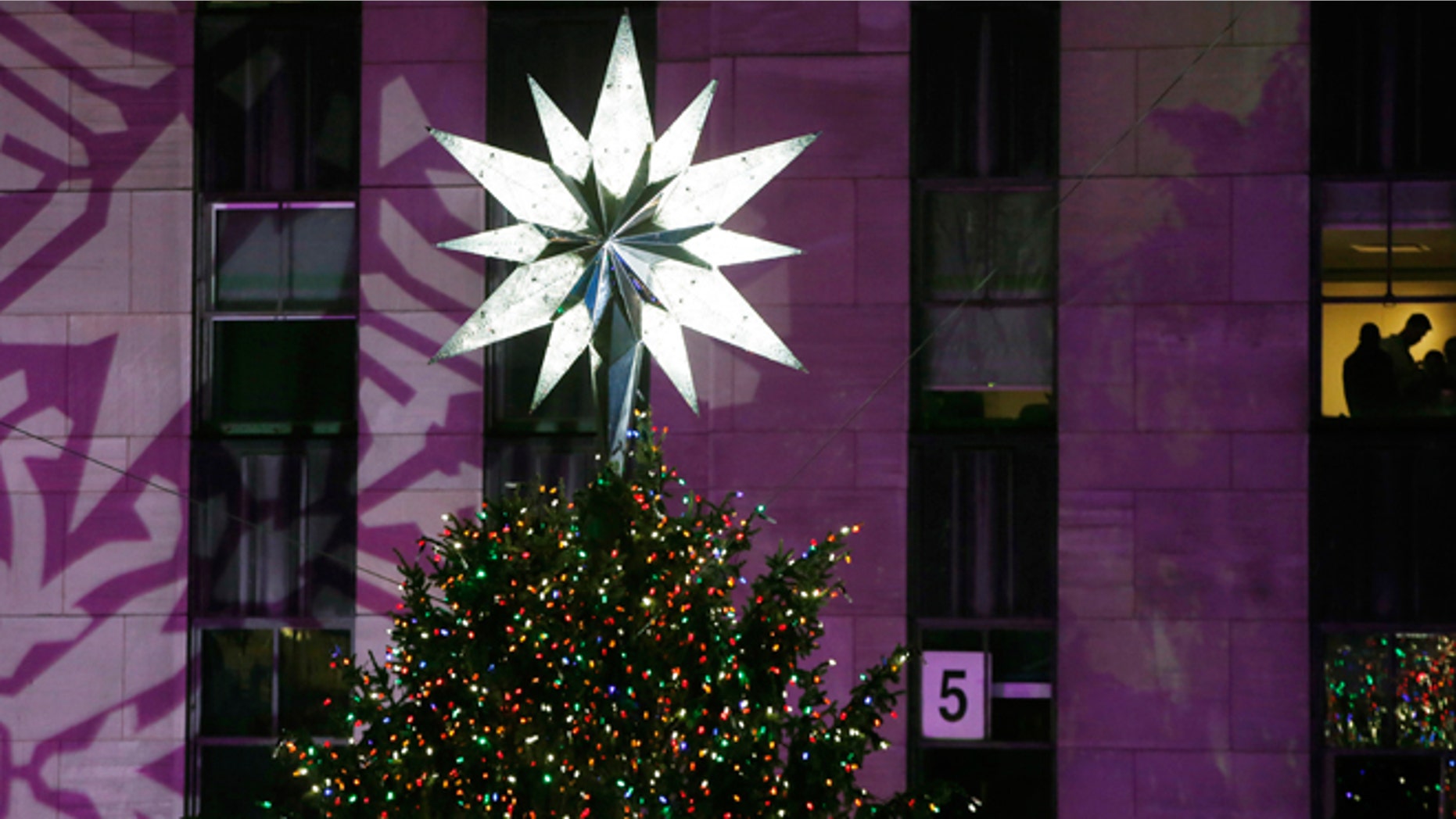 Dec. 4, 2013: The Swarovski star shines atop the Rockefeller Center Christmas tree after it was lit during a ceremony in New York.
